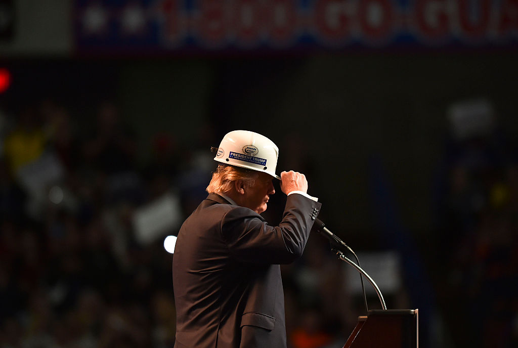 Candidate Donald Trump wears a coal miner's hat, May 5, 2016 in Charleston, WV. CREDIT: Ricky Carioti/Washington Post via Getty Images