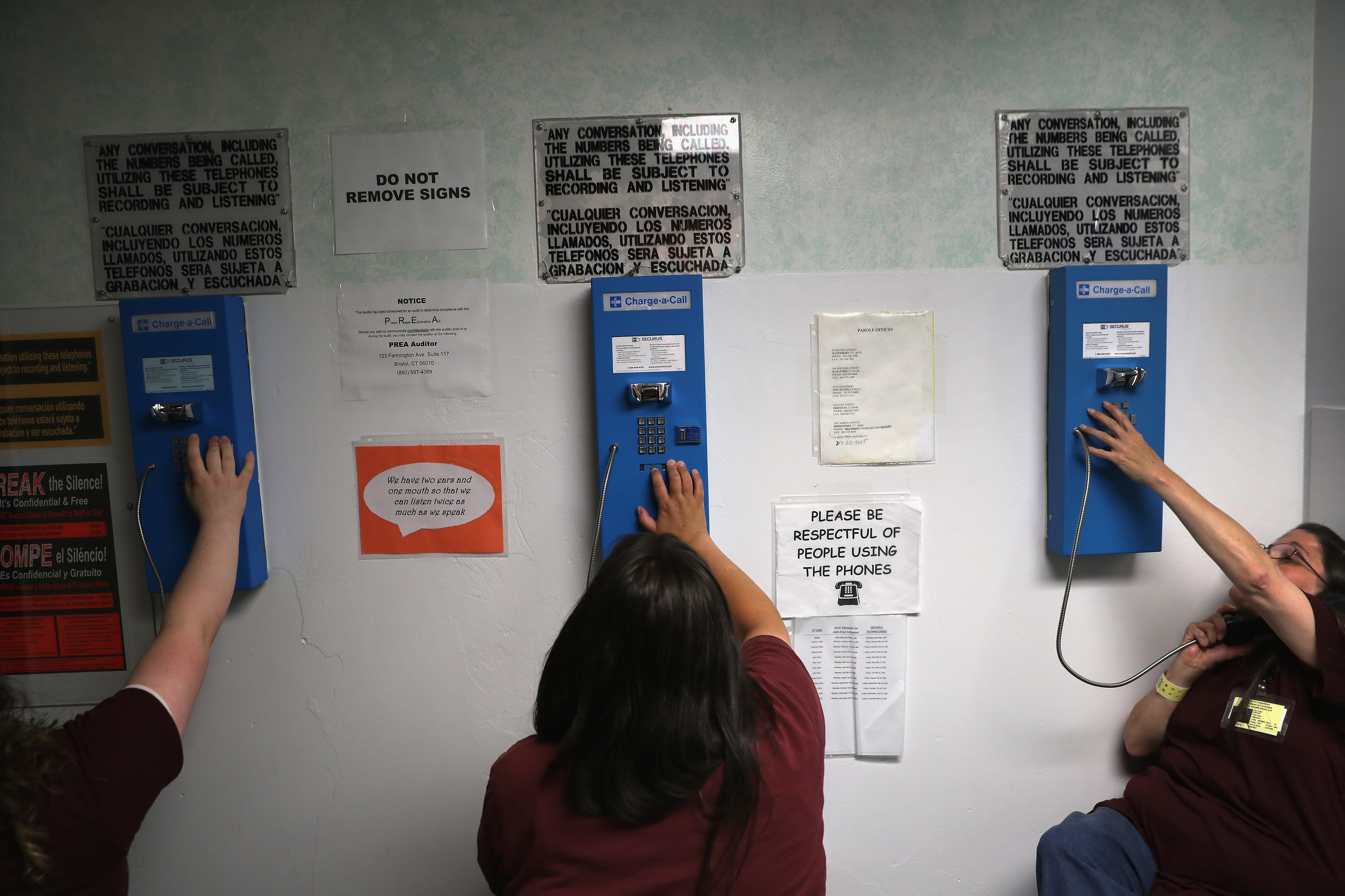 Prison inmates make one of their daily allotment of six phone calls at the York Community Reintegration Center on May 24, 2016 in Niantic, Connecticut. (Credit: John Moore/Getty Images)