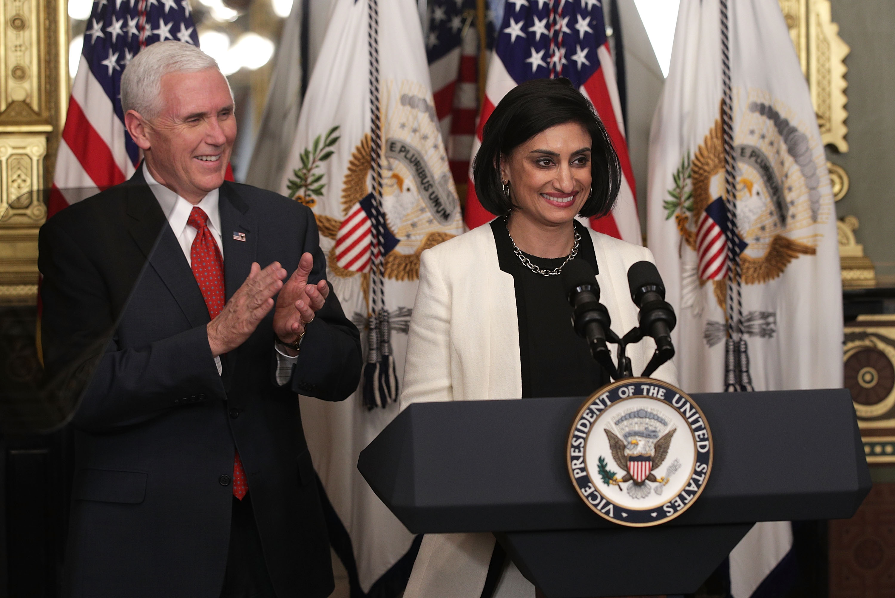 Seema Verma (R) speaks during a swearing-in ceremony, officiated by U.S. Vice President Mike Pence (L), in the Vice President's ceremonial office at Eisenhower Executive Building March 14, 2017. CREDIT: Photo by Alex Wong/Getty Images