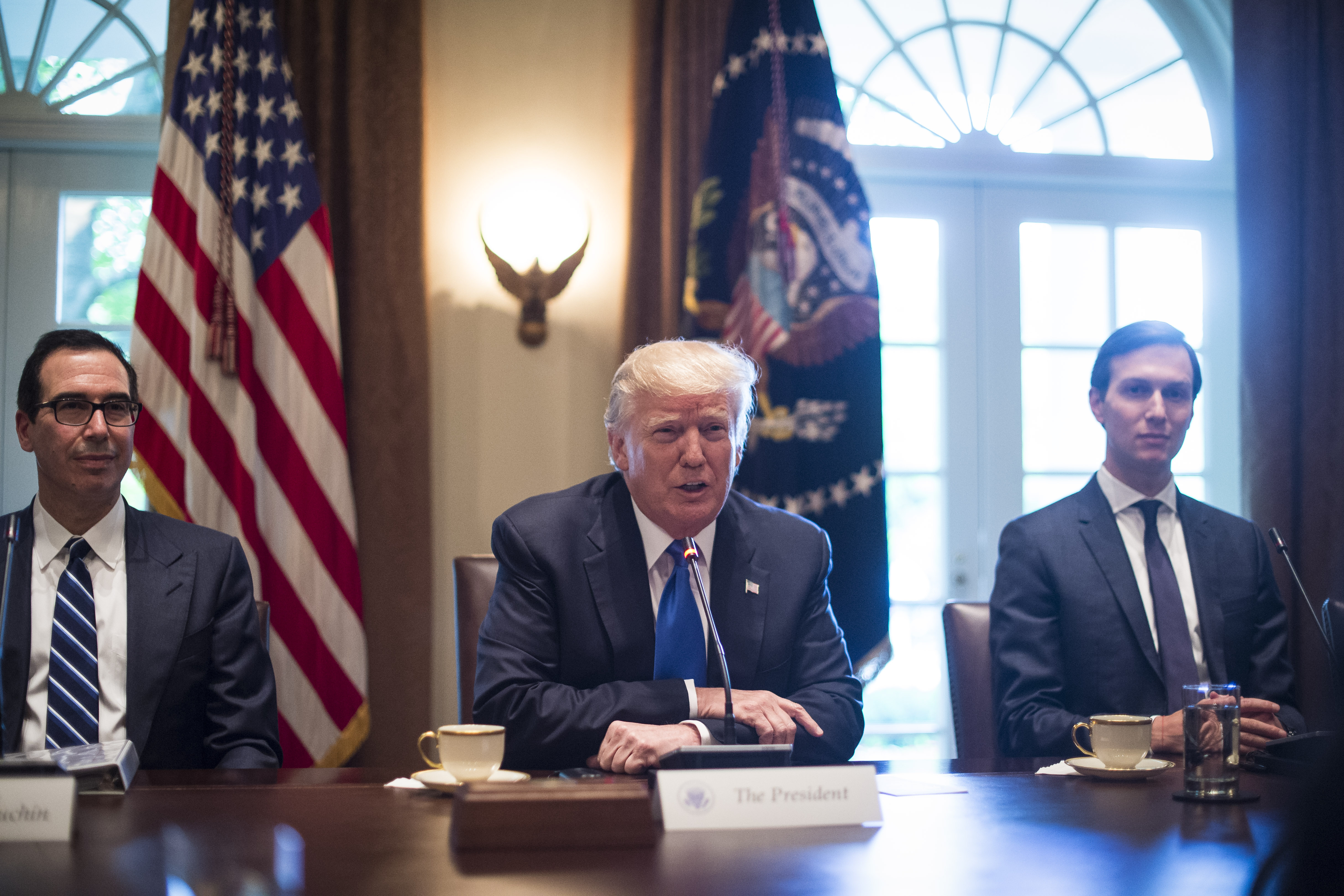 Treasury Secretary Steve Mnuchin, President Donald Trump and White House Senior Adviser Jared Kushner. CREDIT: Jabin Botsford/The Washington Post via Getty Images