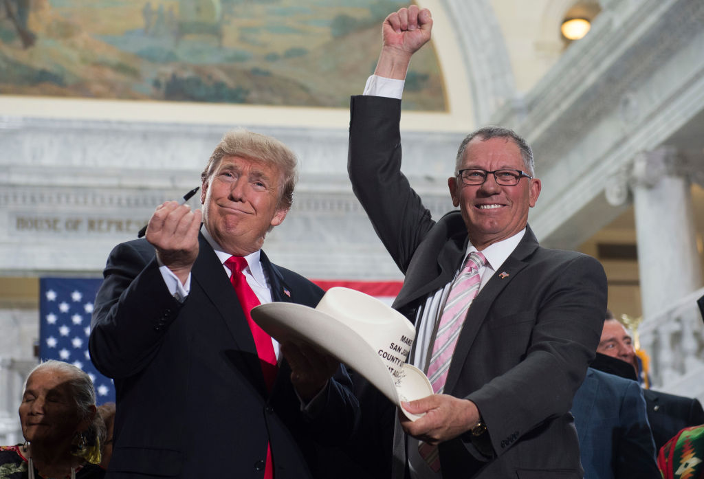 President Trump with Bruce Adams, Chairman of the San Juan County Commission, after signing the proclamation shrinking Bears Ears and Grand Staircase-Escalante national monuments. CREDIT: SAUL LOEB/AFP/Getty Images