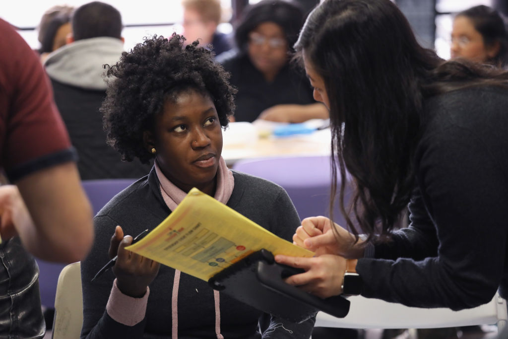 Immigrants receive assistance with their U.S. citizenship applications at a Citizenship Now! event on February 3, 2018 in New York City. CREDIT: John Moore/Getty Images