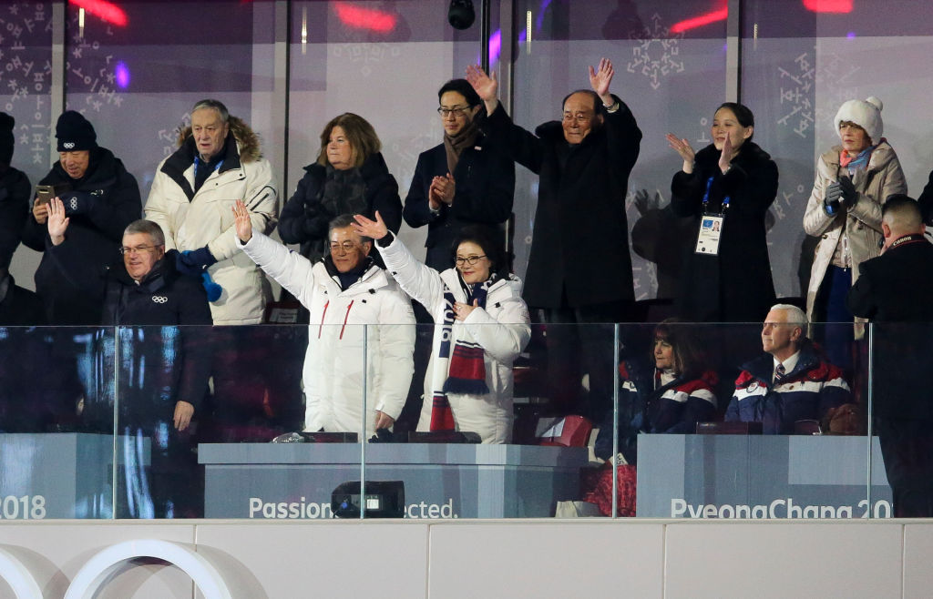 IOC President Thomas Bach, President of South Korea Moon Jae-in, his wife Kim Jung-sook, President of North Korea Kim Yong-nam and Kim Yo-jong, sister of Kim Jong-un cheer Korean athletes while Vice President Mike Pence and his wife Karen look on. CREDIT: Jean Catuffe/Getty Images
