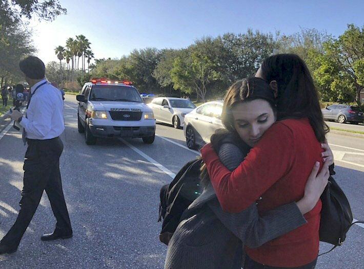 Students react at Marjory Stoneman Douglas High School in Parkland, Florida, a city about 50 miles (80 kilometers) north of Miami on February 14, 2018 following a school shooting.
CREDIT: MICHELE EVE SANDBERG/AFP/Getty Images