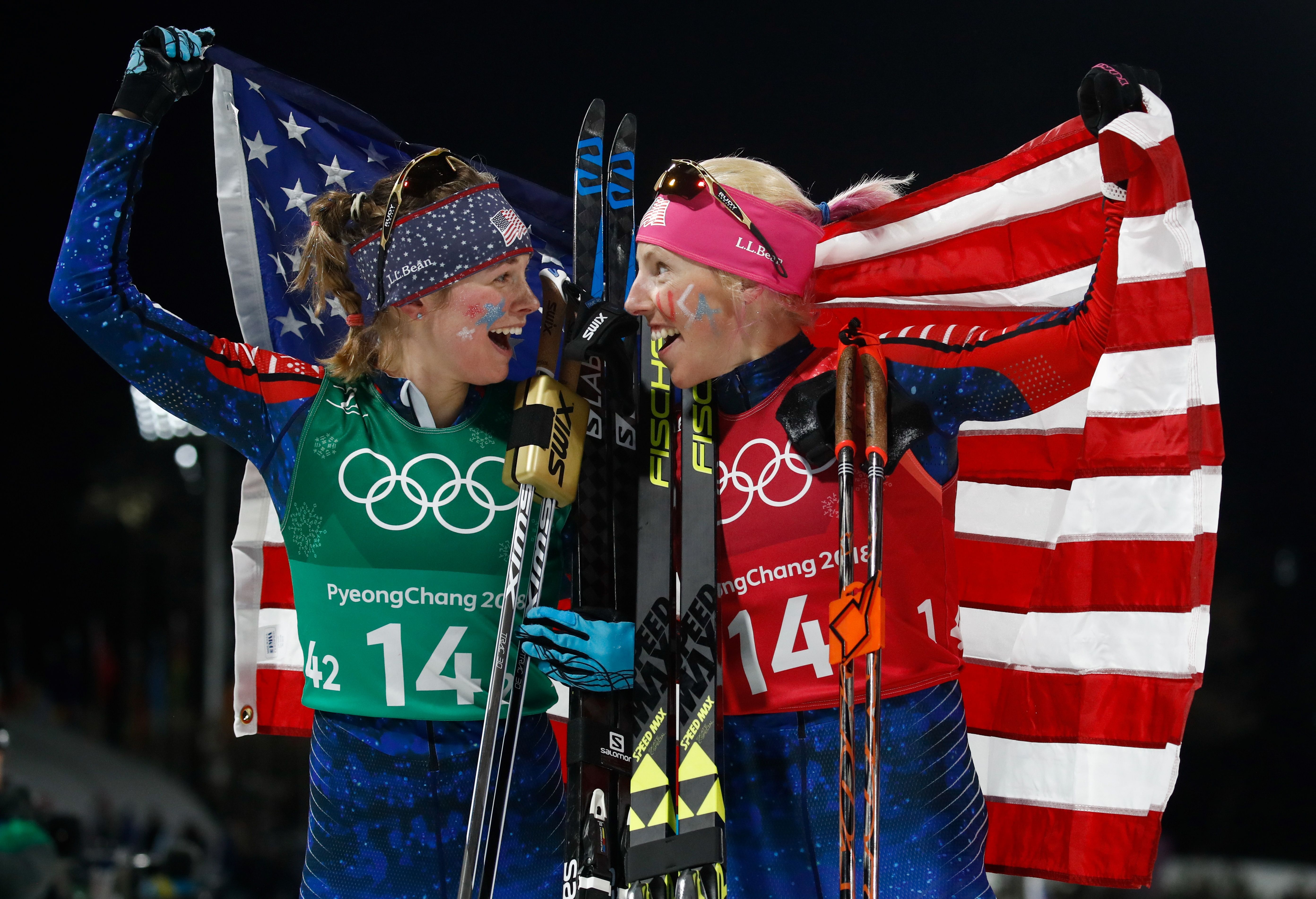 TOPSHOT - USA's Jessica Diggins (L) and USA's Kikkan Randall celebrate winning gold in the women's cross country team sprint free final at the Alpensia cross country ski centre during the Pyeongchang 2018 Winter Olympic Games on February 21, 2018 in Pyeongchang. / AFP PHOTO / Odd ANDERSEN (Photo credit should read ODD ANDERSEN/AFP/Getty Images)