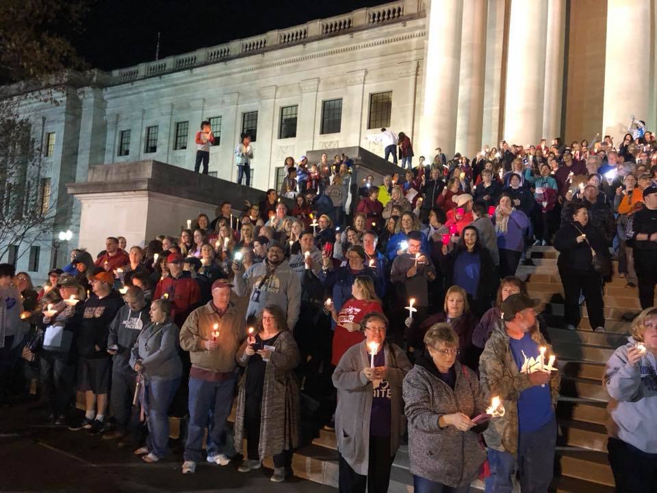 West Virginia teachers, school staff, and allies gather at the capitol grounds for a candlelight vigil. (CREDIT: AFT-West Virginia/Facebook)