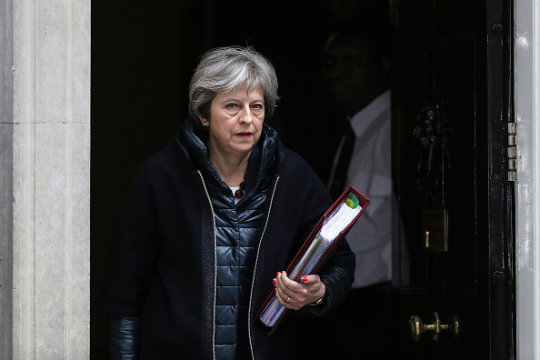 Theresa May, U.K. prime minister, leaves 10 Downing Street following a meeting in London, U.K., on Wednesday, March 14, 2018. May publicly blamed Russia for poisoning a former spy and his daughter on British soil, as escalating tension between the Kremlin and the West raised fears of a new Cold War. (CREDIT: Simon Dawson/Bloomberg via Getty Images)