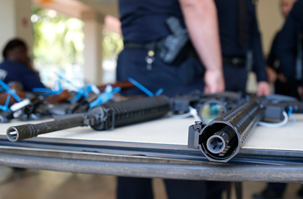 Two AR-15 rifles sit on a table after being surrendered during a City of Miami gun buy-back event in Miami, Florida on March 17, 2018. (Photo credit: WISE/AFP/Getty Images)