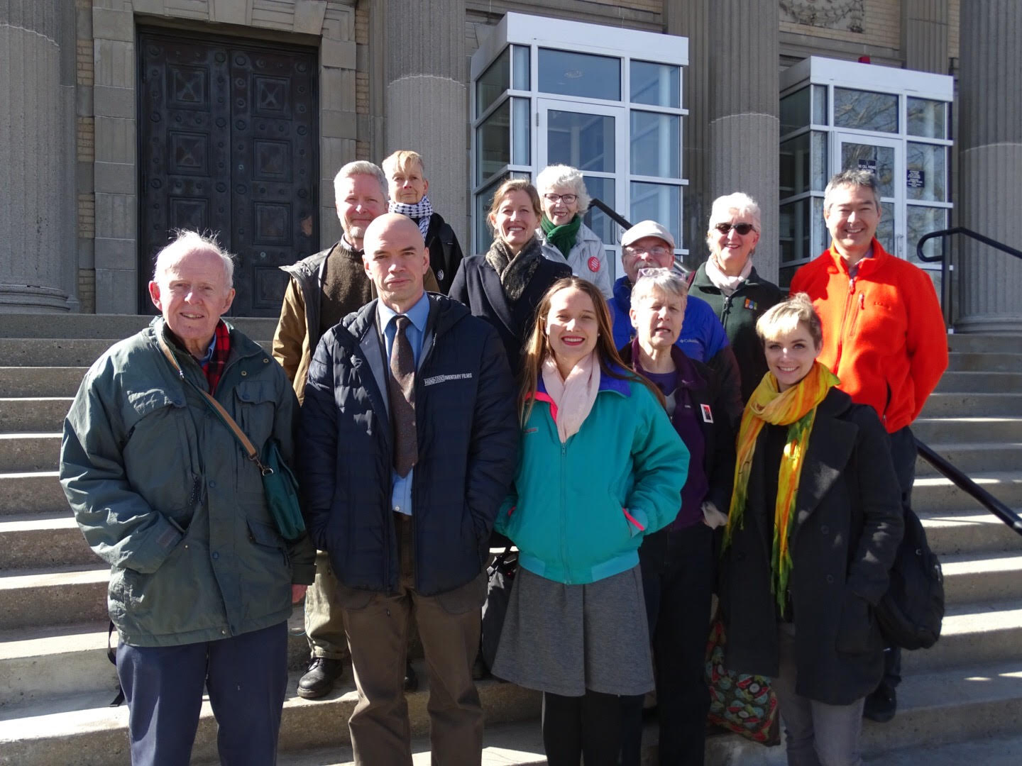 Defendants stand outside a courthouse in West Roxbury, MA, after hearing that a judge found them not responsible for protest charges on the basis of necessity. (CREDIT: Peter Bowden)