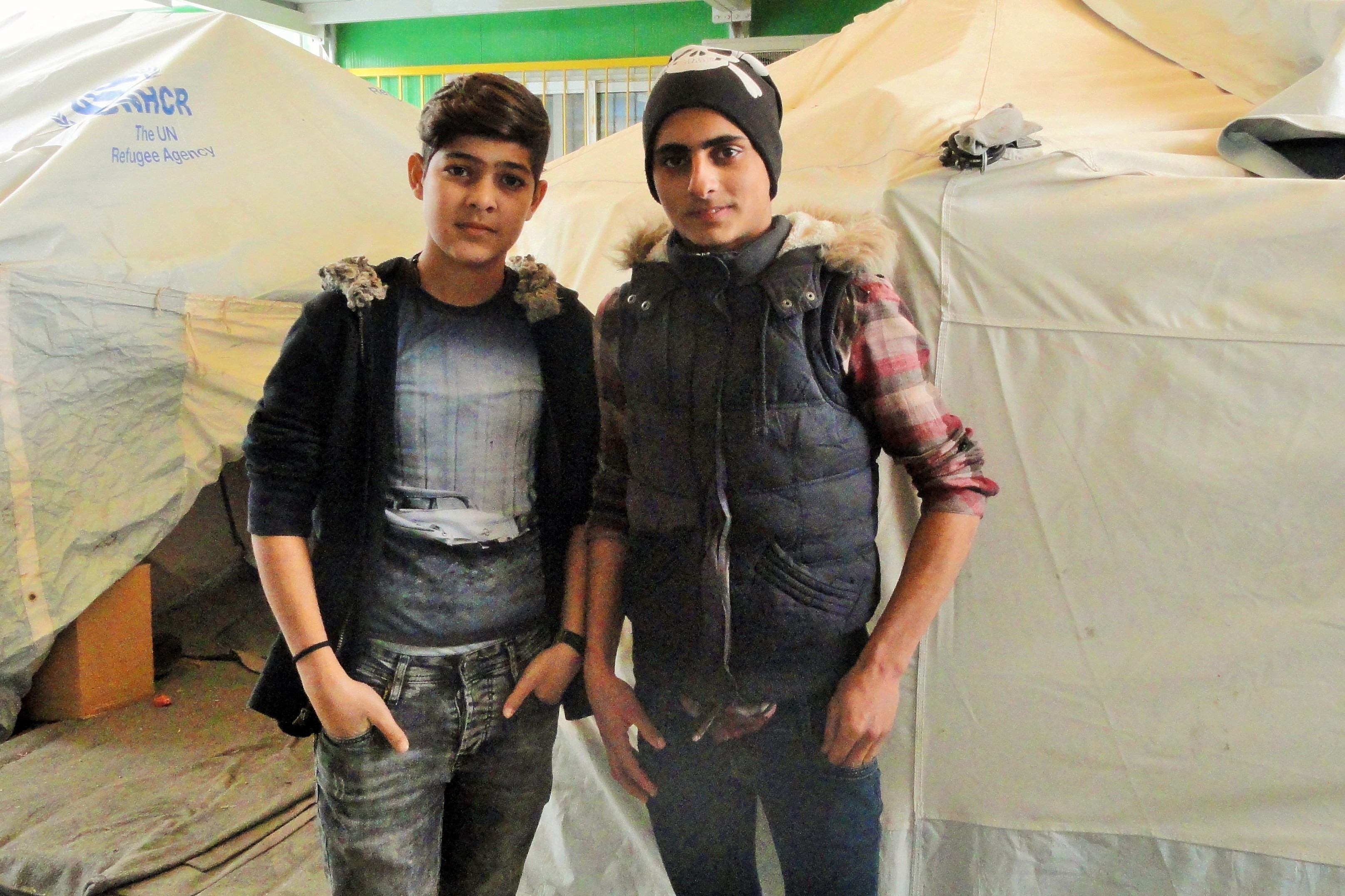 Sixteen-year-olds Yunis, from Aleppo, Syria, and Abdulrahman, from Baghdad, have each been at Moria for several months. Yunis, there with three of his siblings, longs to go to Germany, where he has family, and Abdulrahman said he'd pretty much go anywhere, but, he said, "I love America. I am waiting for America to love Arabs." CREDIT: D. Parvaz/ThinkProgress