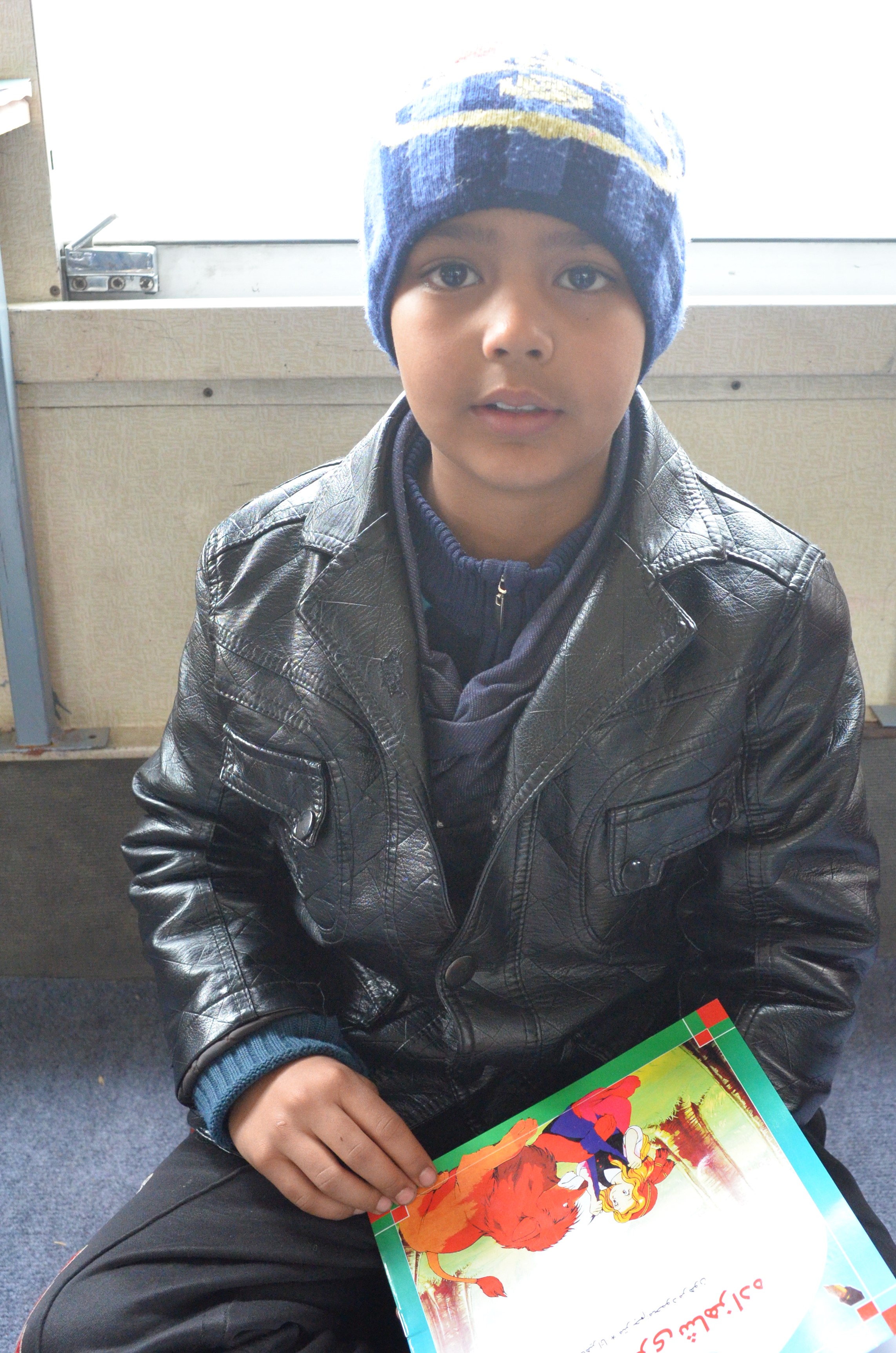 Mohammad Najib reads a book at the Charmaghz library. (credit: Ali M. Latifi for ThinkProgress)