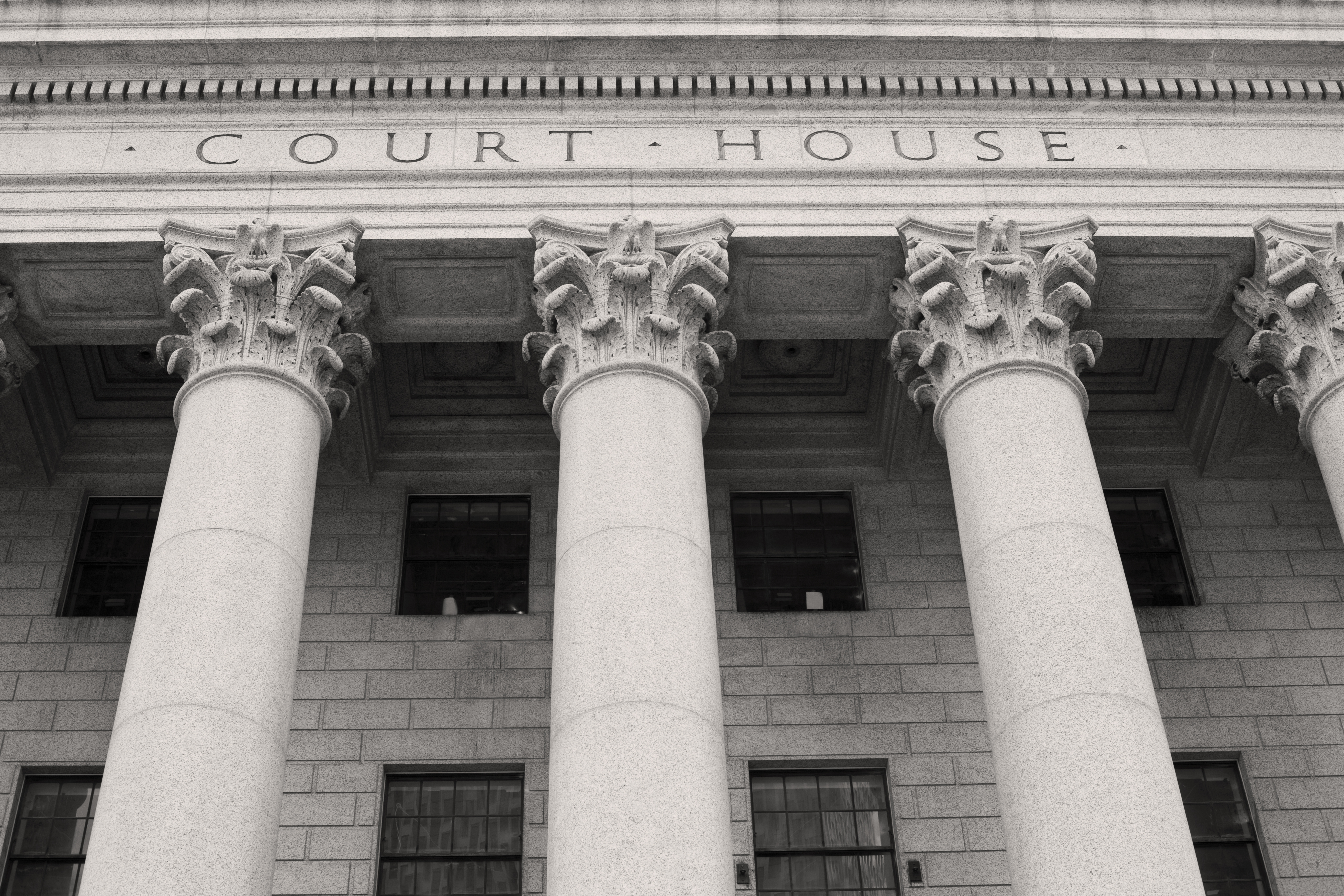 Facade of courthouse with columns. CREDIT: Getty Images
