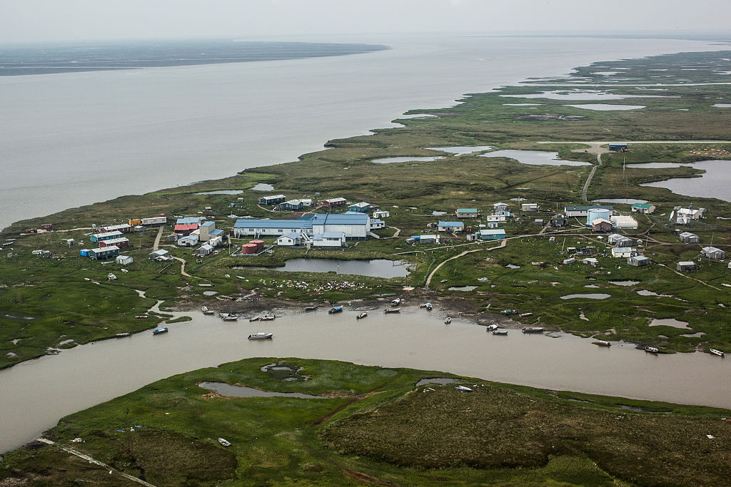 As global temperatures rise Newtok is being threatened by melting permafrost, greater ice and snow melt, larger storms, and coastal erosion. Photo by Andrew Burton/Getty Images.