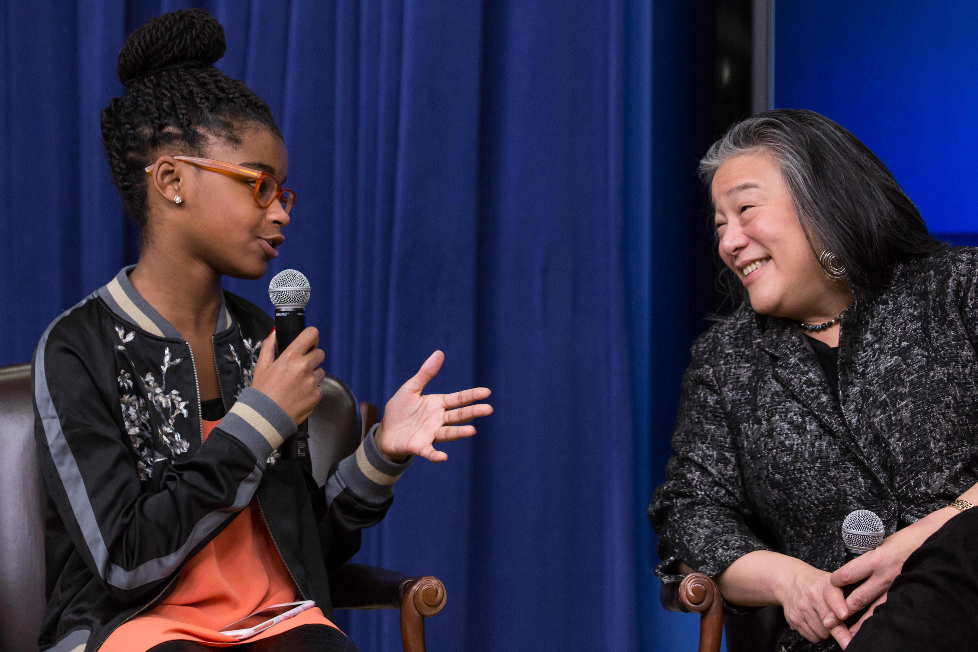 In the South Court Auditorium of the Eisenhower Executive Office Building of the White House in Washington DC, 11-year-old Marley Dias, Editor of Marley Mag, speaks, as Tina Tchen, Assistant to the President, Chief of Staff to the First Lady and Director of the White House Council on Women and Girls, listens. CREDIT: Cheriss May/NurPhoto via Getty Images)