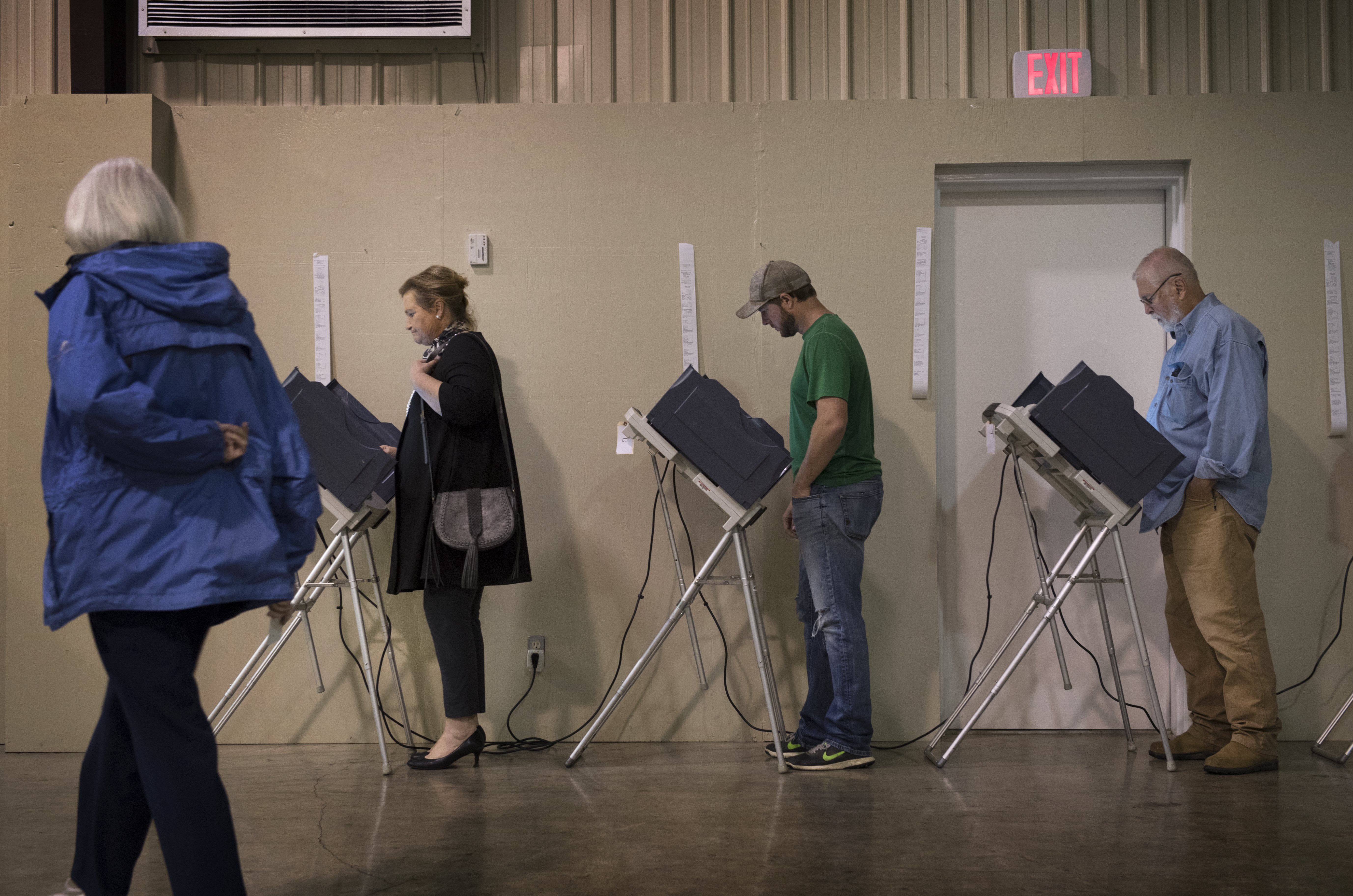 Vicki Slater (far left), a Democratic activist, votes at Highland Chapel, a polling place on election day in Madison, MS on November 8, 2016. CREDIT: Linda Davidson/The Washington Post via Getty Images)