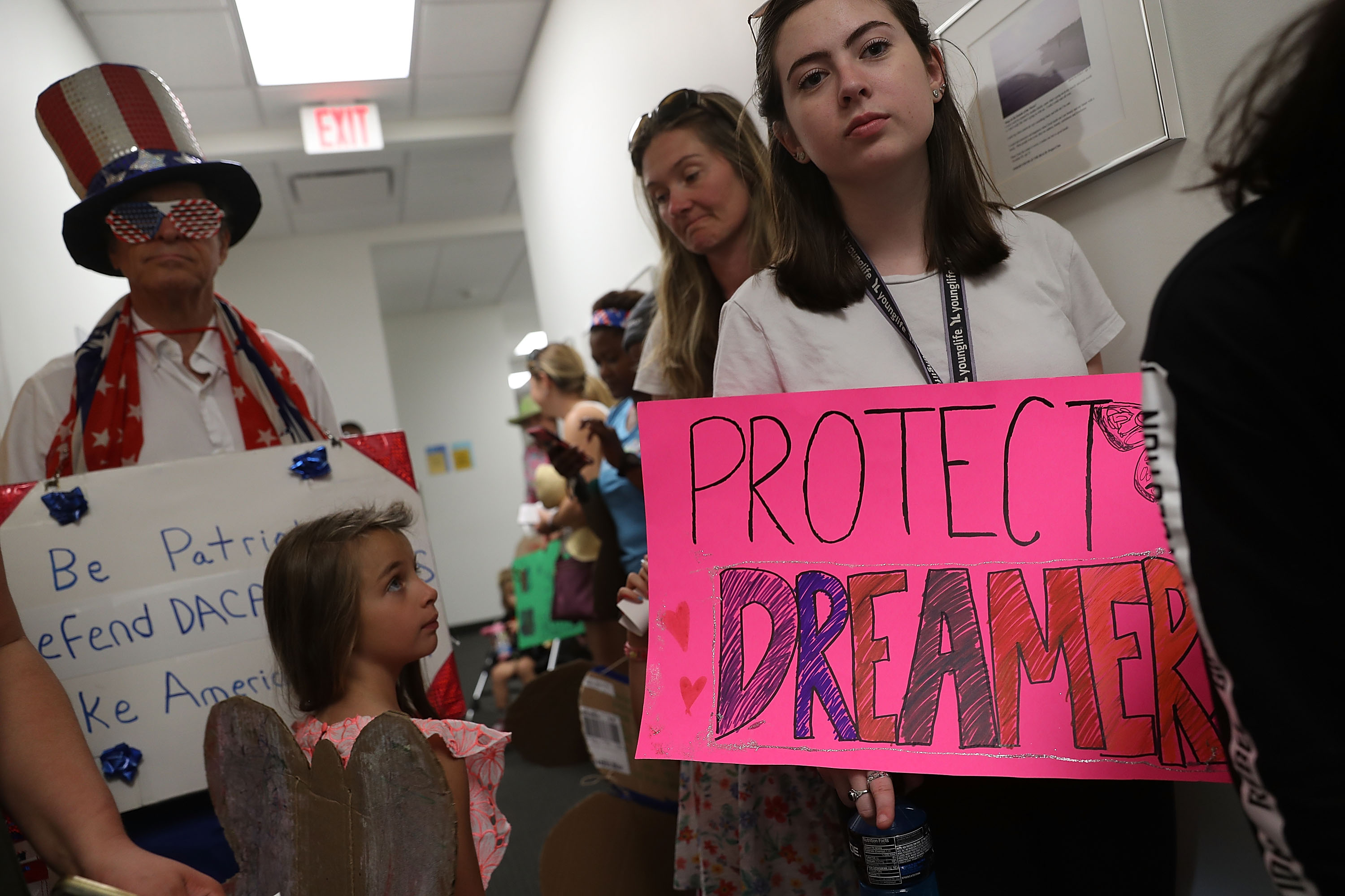 WEST PALM BEACH, FL - FEBRUARY 02: Lily Logsdon (R) joins with other activists in front of the office of Sen. Bill Nelson (D-FL) to ask him to help recipients of the Deferred Action for Childhood Arrivals (DACA) as well as all immigrants living in America on February 2, 2018 in West Palm Beach, Florida. (Photo by Joe Raedle/Getty Images)