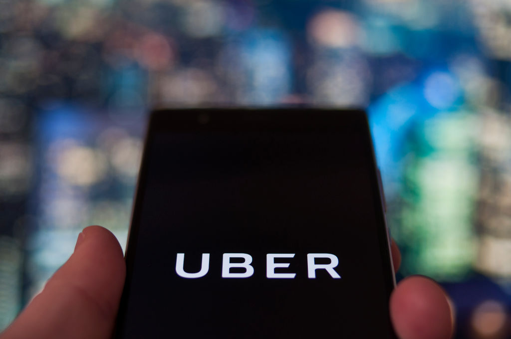 The Uber ride sharing app is seen on a mobile phone on February 12, 2018. (CREDIT: Jaap Arriens/NurPhoto via Getty Images)