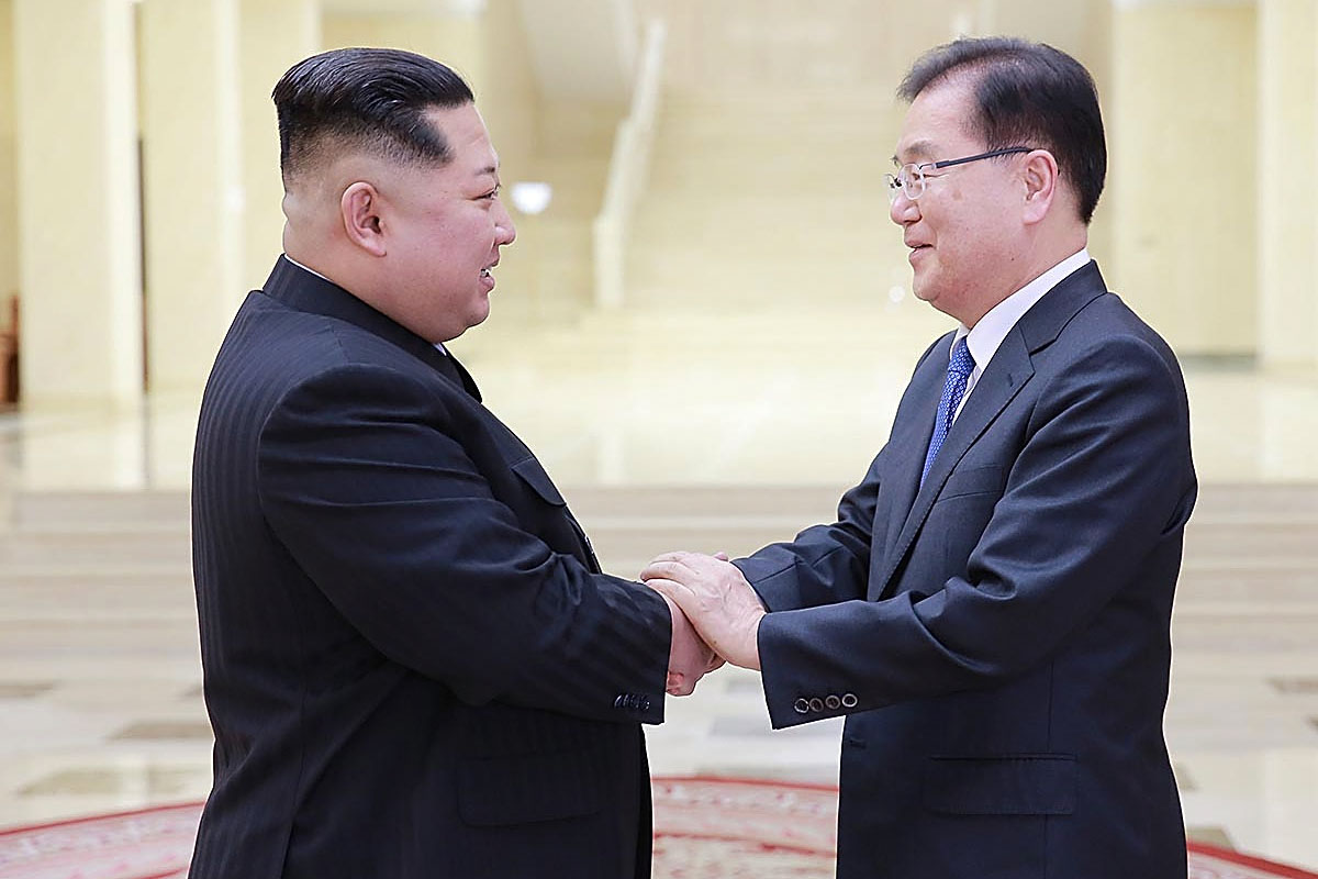 In this handout image provided by the South Korean Presidential Blue House, Chung Eui-Yong (R), head of the presidential National Security Office shakes hands with North Korean leader Kim Jong-Un (L) during their meeting on March 5, 2018 in Pyongyang, North Korea. CREDIT: South Korean Presidential Blue House/Getty Images.