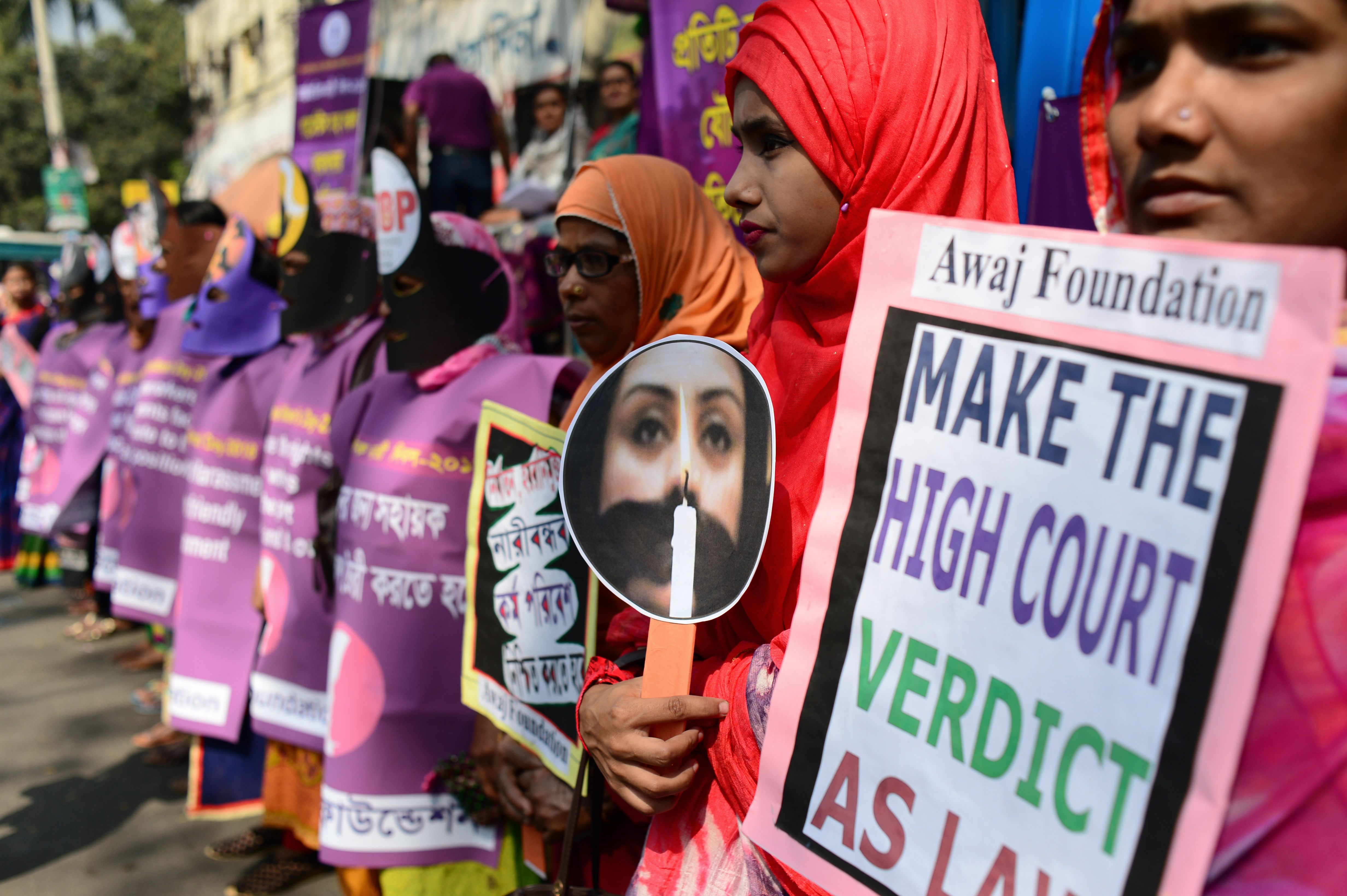 Bangladeshi women holding placards take part in a rally to mark International Women's Day in Dhaka on March 8, 2018.
Thousands of Bangladeshi women, non-governmental organisations and rights groups activists took to the streets demanding safer lives for women in the country as well as an improvement in their social conditions. (CREDIT: MUNIR UZ ZAMAN/AFP/Getty Images)