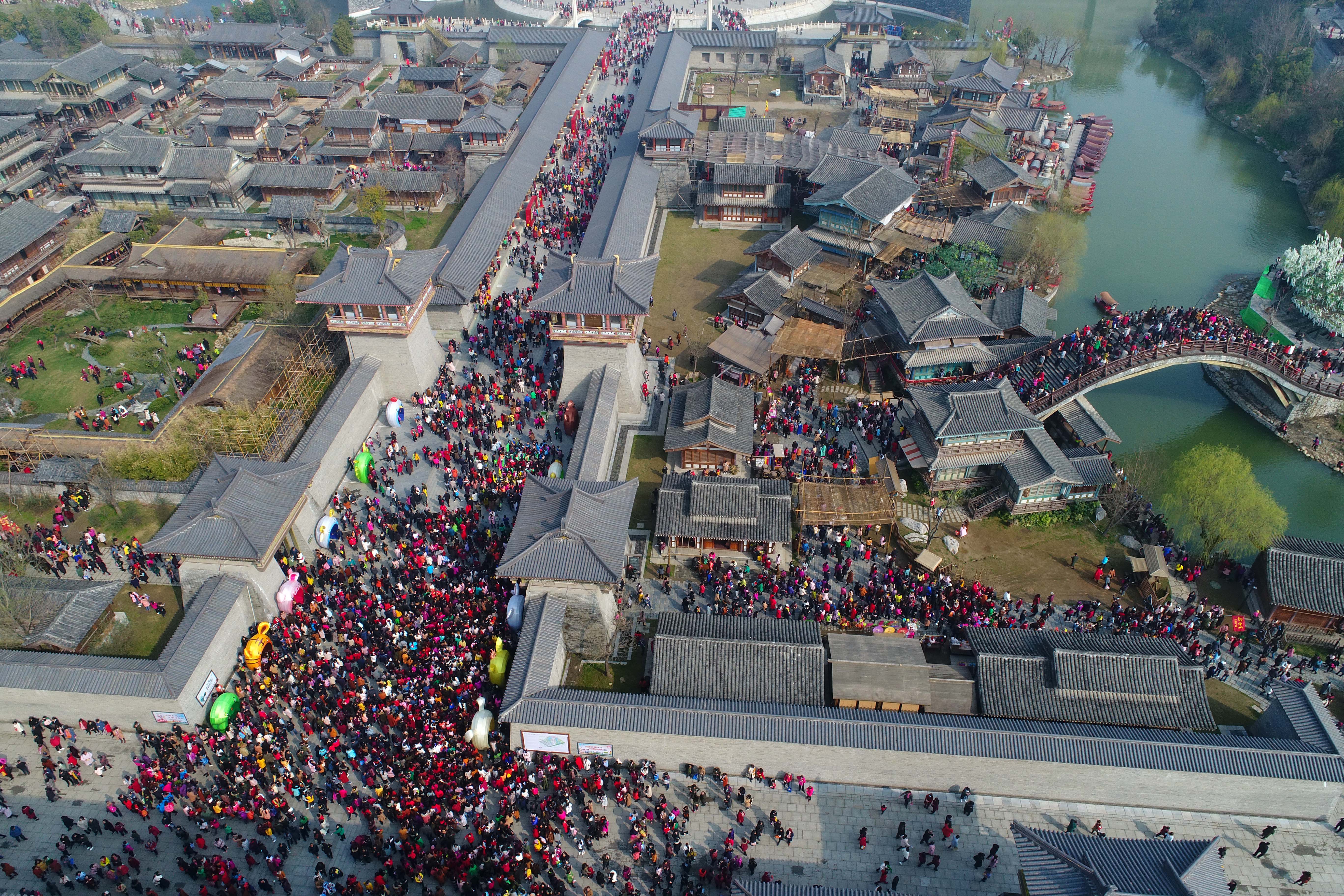 Aerial view of citizens visiting Tangcheng Film and Television Base during International Women's Day on March 8, 2018 in Xiangyang, Hubei Province of China. Tangcheng Film and Television Base was free of charge for female visitors on International Women's Day that attracted about one hundred thousand visitors. (CREDIT: VCG/VCG via Getty Images)