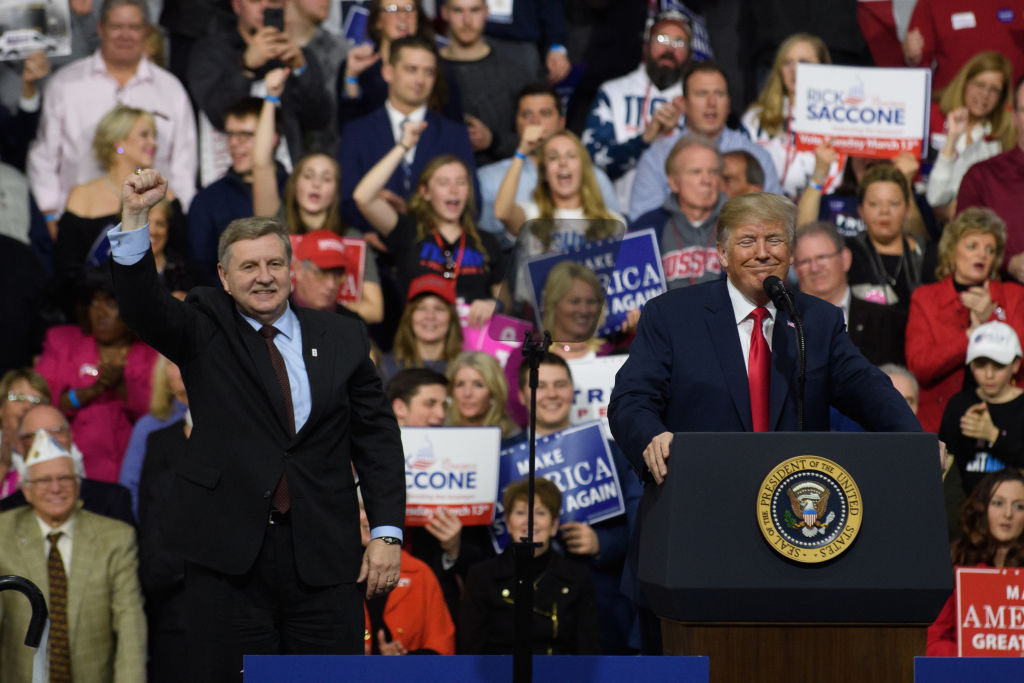 President Donald J. Trump with Rick Saccone speaks to supporters at the Atlantic Aviation Hanger on March 10, 2018 in Moon Township, Pennsylvania. (CREDIT: Jeff Swensen/Getty Images)