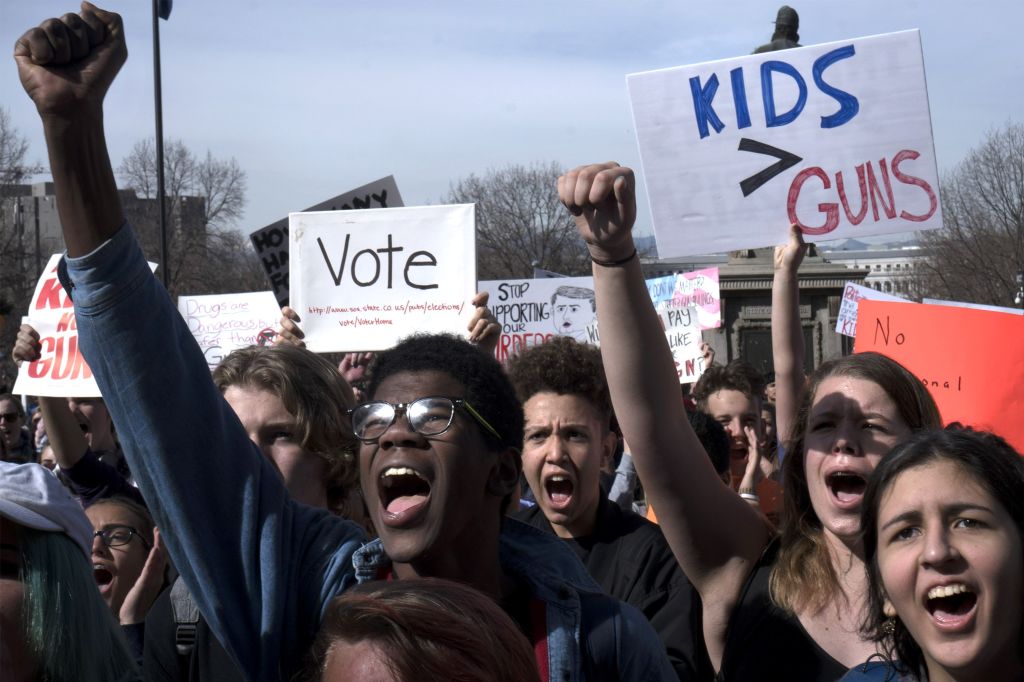 DENVER, CO - MARCH 14: (L-R) Aaron Durst, 17; Brandon Crawford, 15; Hannah Hageseth, 14; and Ren Baxter, 15, all students at East High School in Denver, protest against gun violence on the Colorado State Capitol grounds on March 14, 2018 in Denver, Colorado. (CREDIT: Ross Taylor/Getty Images)