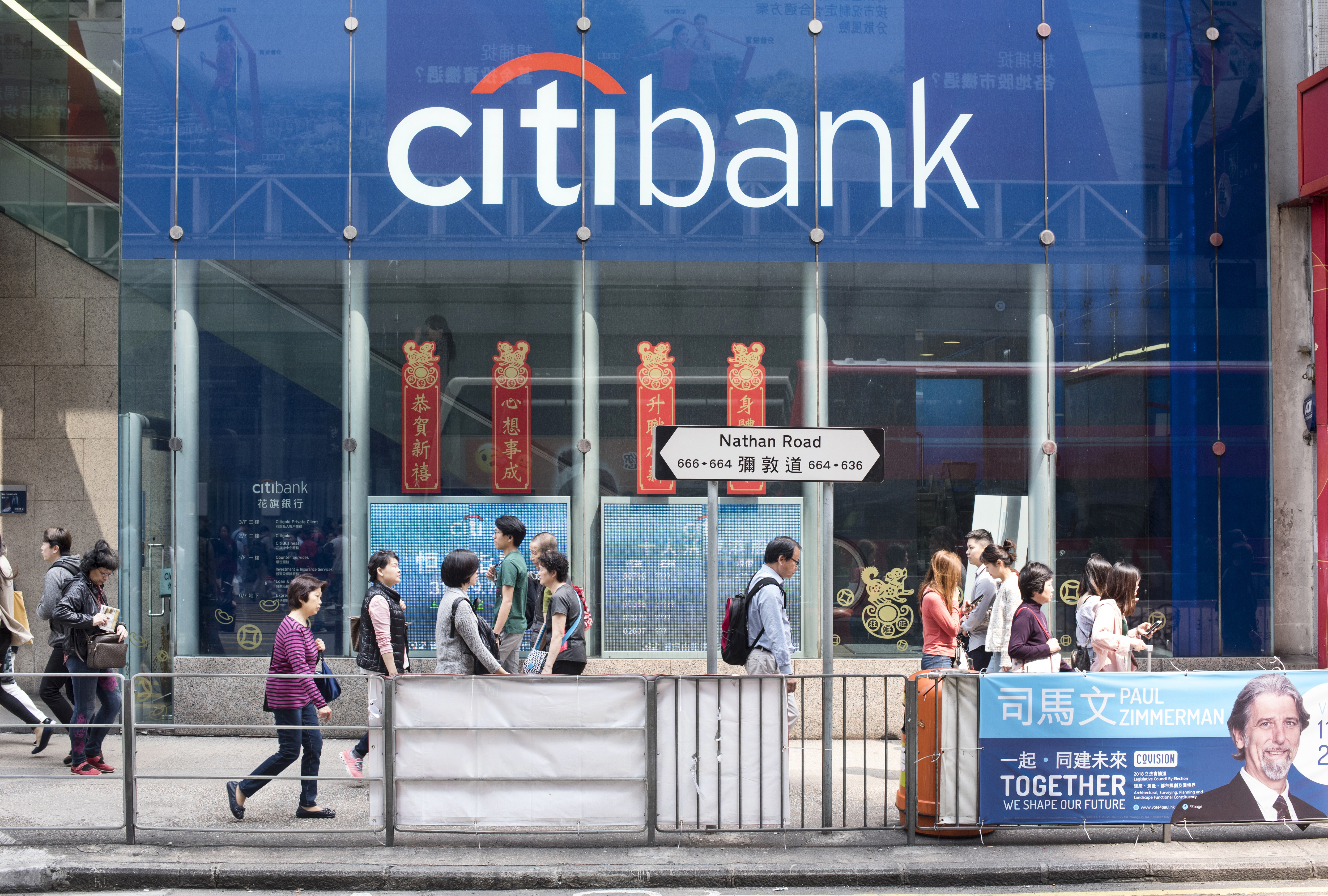 Pedestrians walks past a branch of Citibank in Mong Kok, Hong Kong. (Photo by Miguel Candela/SOPA Images/LightRocket via Getty Images)