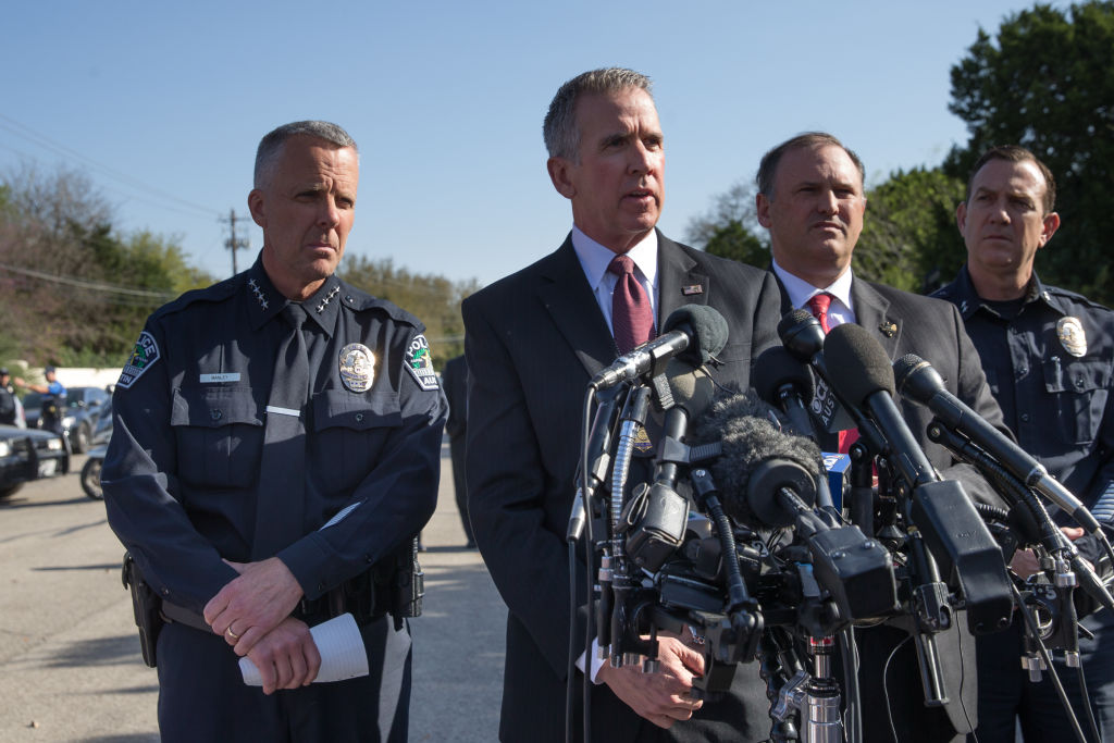 Austin Police Chief Brian Manley (L), ATF Special Agent in Charge Fred Milanowski, and FBI Agent Christopher Combs brief reporters during a press conference on March 19, 2018, in Austin, Texas.
CREDIT: SUZANNE CORDEIRO/AFP/Getty Images