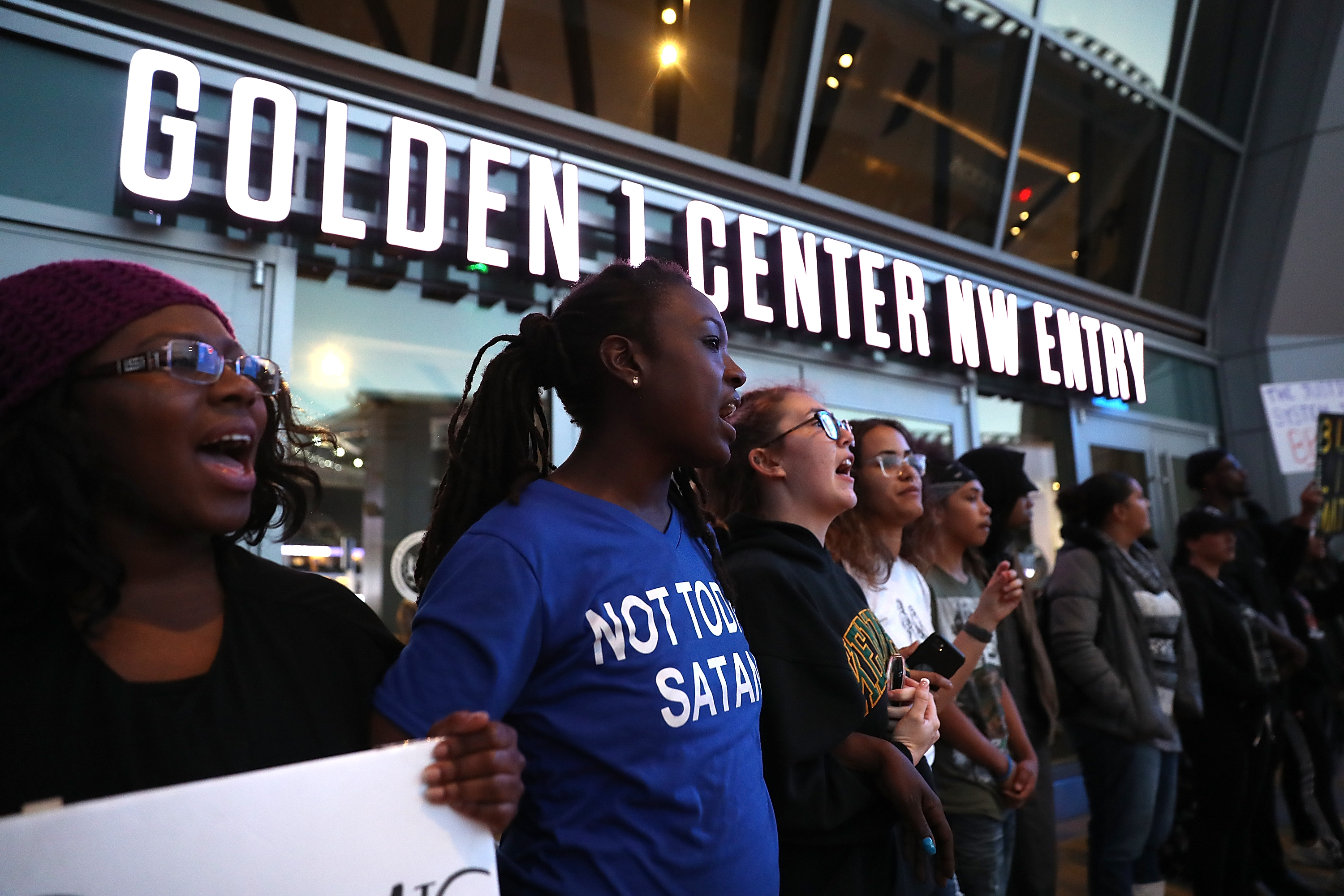 SACRAMENTO, CA - MARCH 22: Black Live Matter protesters chant as they block the entrance to the Golden 1 Center during a demonstration on March 22, 2018 in Sacramento, California. CREDIT: Justin Sullivan/Getty Images)