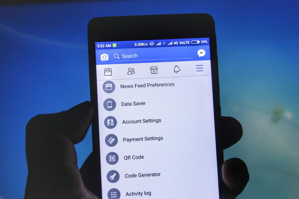 FILE PICTURE: A user checks the settings of facebook on his mobile phone (Photo by Nasir Kachroo/NurPhoto via Getty Images)