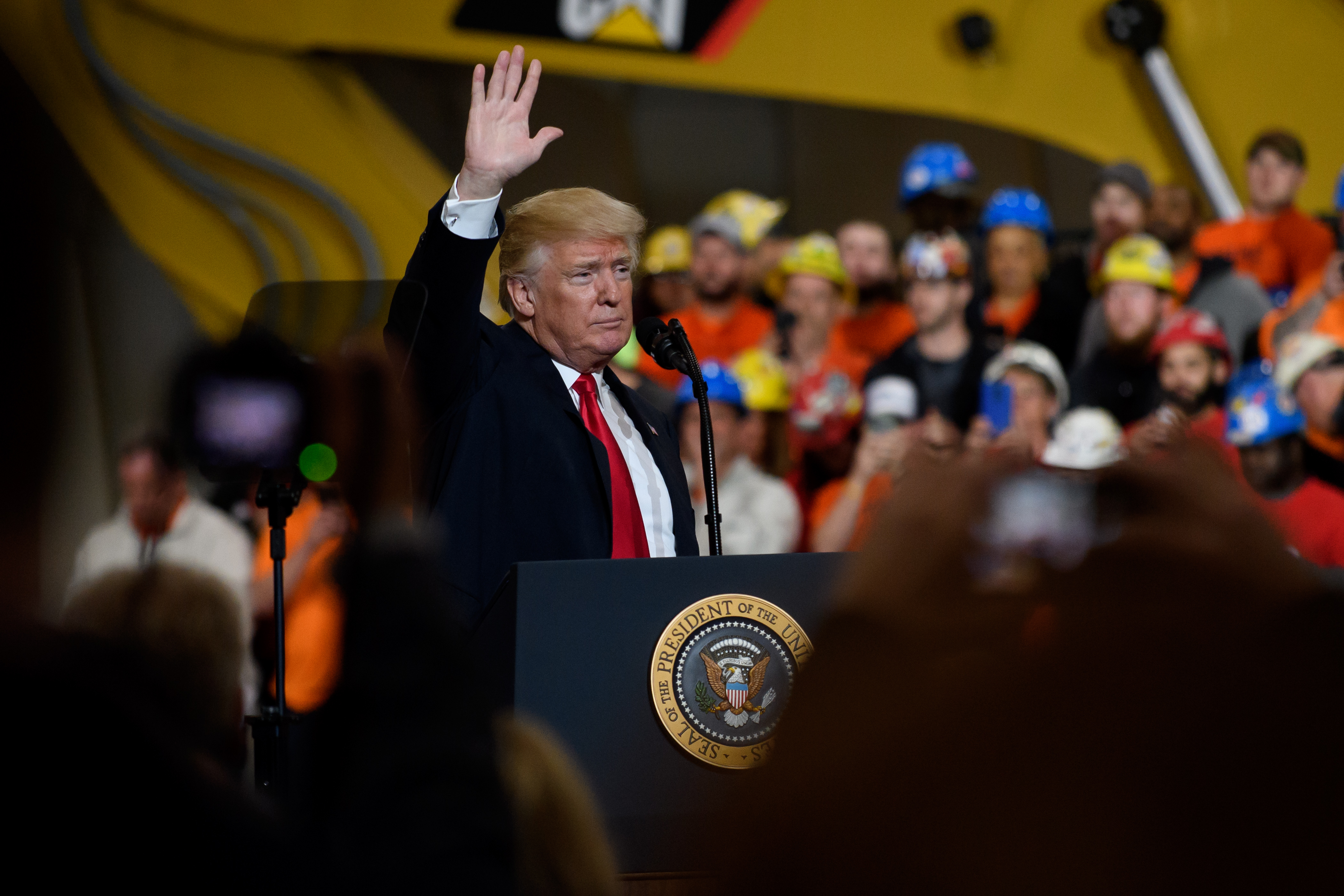 President Donald Trump speaks to a crowd gathered at the Local 18 Richfield Facility of the Operating Engineers Apprentice and Training, a union and apprentice training center specializing in the repair and operation of heavy equipment on March 29, 2018 in Richfield, Ohio. CREDIT: Jeff Swensen/Getty Images.