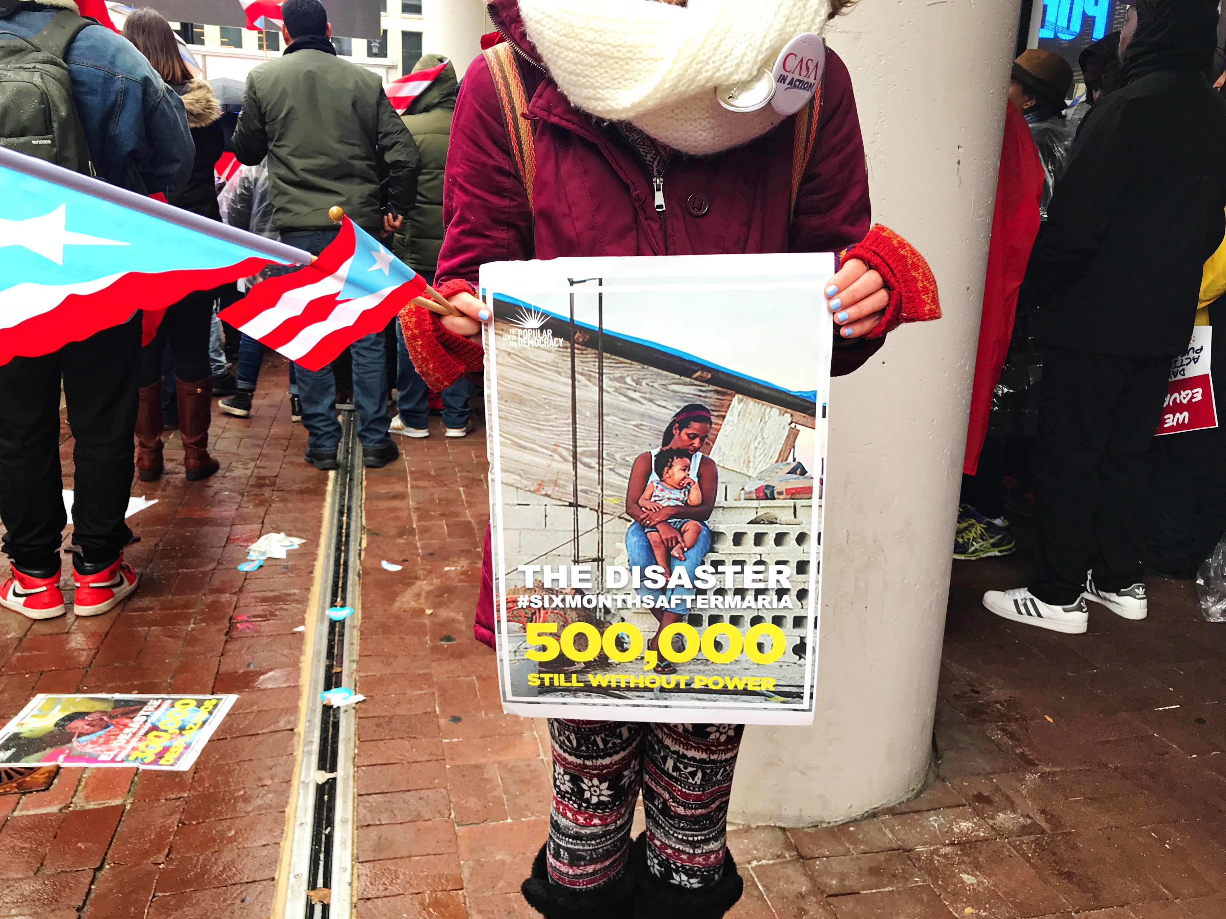 A protester holds a sign at a rally for Puerto Rico on March 20 in Washington, D.C. (CREDIT: Melanie Schmitz, ThinkProgress)