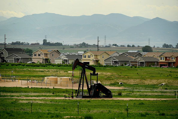 An oil drilling operation near a subdivision in Weld County, Colorado. CREDIT: Helen H. Richardson/The Denver Post via Getty Images