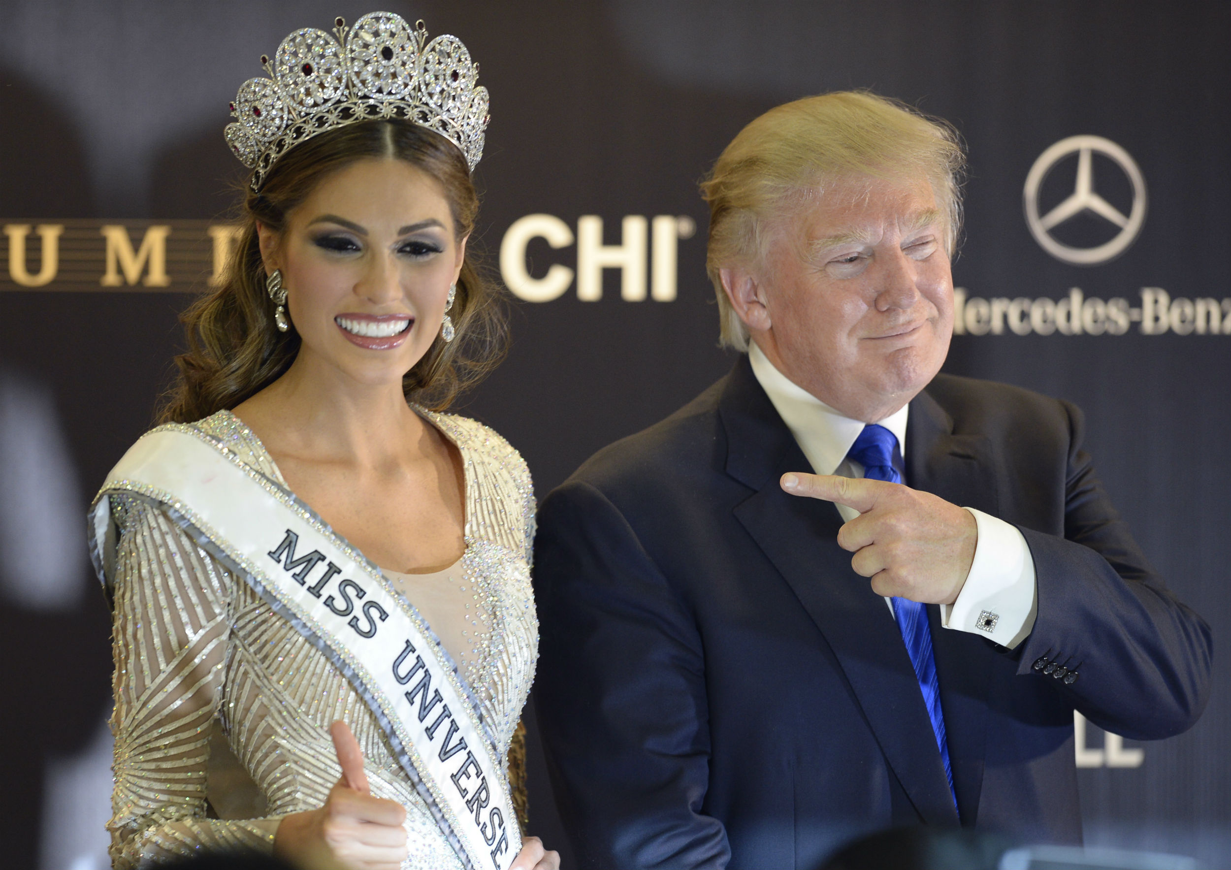Trump poses next to Miss Venezuela and Miss Universe 2013 Gabriela Isler after the 2013 Miss Universe competition in Moscow on November 9, 2013. (CREDIT: ALEXANDER NEMENOV/GETTY)