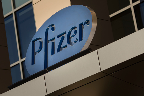 A sign for Pfizer pharmaceutical company is seen on a building in Cambridge, Massachusetts (DOMINICK REUTER/AFP/Getty Images)