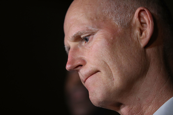 Gov. Rick Scott speaks to the media as he visits Marjory Stoneman Douglas High School. CREDIT: Joe Raedle/Getty Images