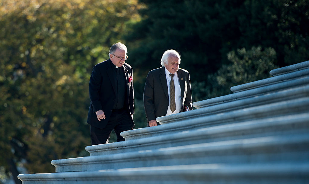 Rev. Patrick J. Conroy, Chaplain of the U.S. House of Representatives, left, says an aide for House Speaker Paul Ryan told him he was "getting too political." Ryan recently asked Conroy to resign. (CREDIT: Bill Clark/CQ Roll Call)