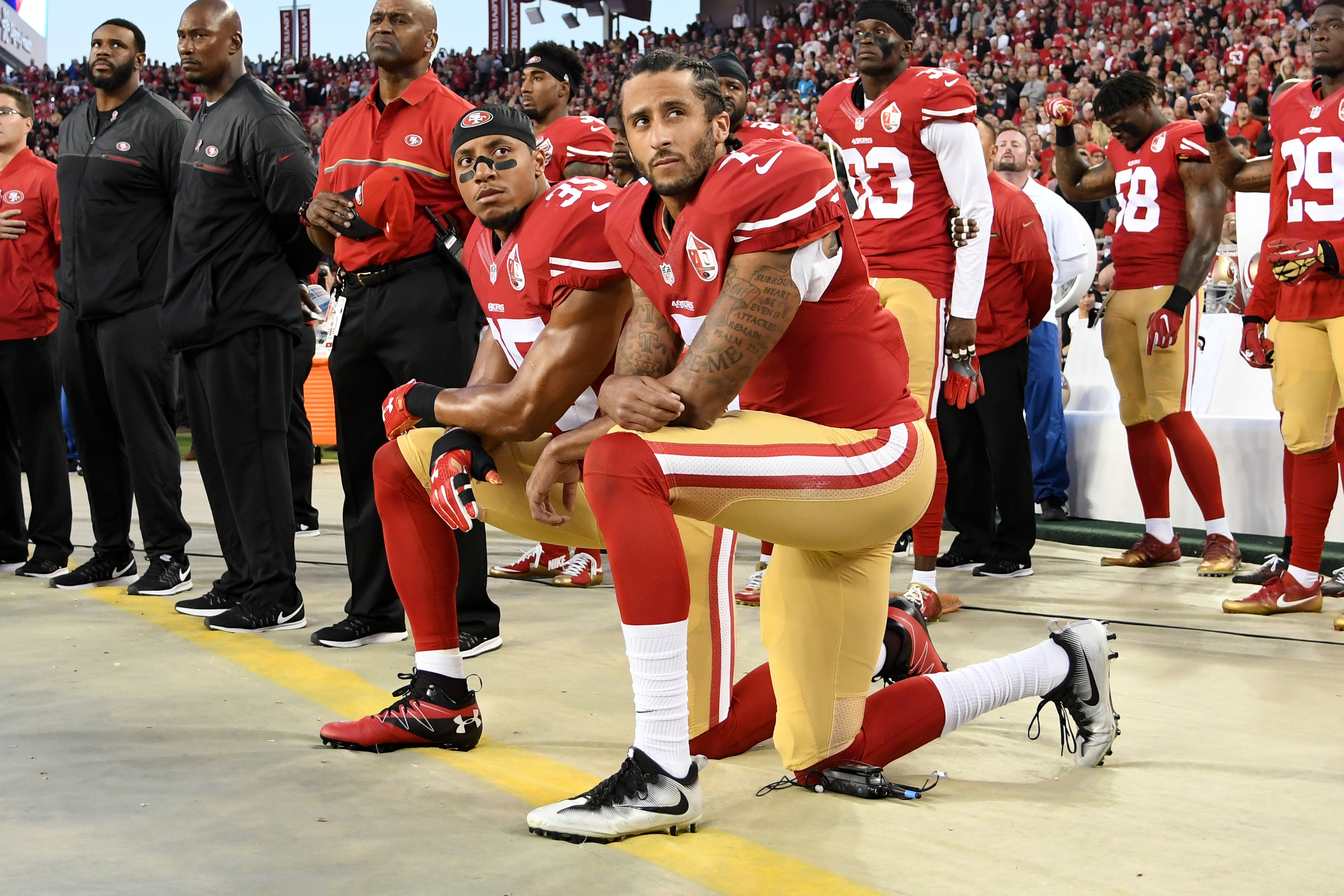 SANTA CLARA, CA - SEPTEMBER 12: Colin Kaepernick #7 and Eric Reid #35 of the San Francisco 49ers kneel in protest during the national anthem prior to playing the Los Angeles Rams in their NFL game at Levi's Stadium on September 12, 2016 in Santa Clara, California. (Photo by Thearon W. Henderson/Getty Images)