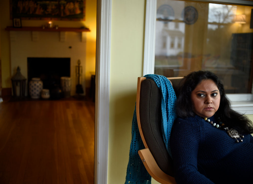 The Trump administration is quietly cracking down on documented immigrants through the H1-B and H-4 visa programs. Pictured: Sudarshana Sengupta, a research associate and legal immigrant from India, has been waiting for her green card since being approved in 2010. (CREDIT: Jessica Hill/For The Washington Post via Getty Images)