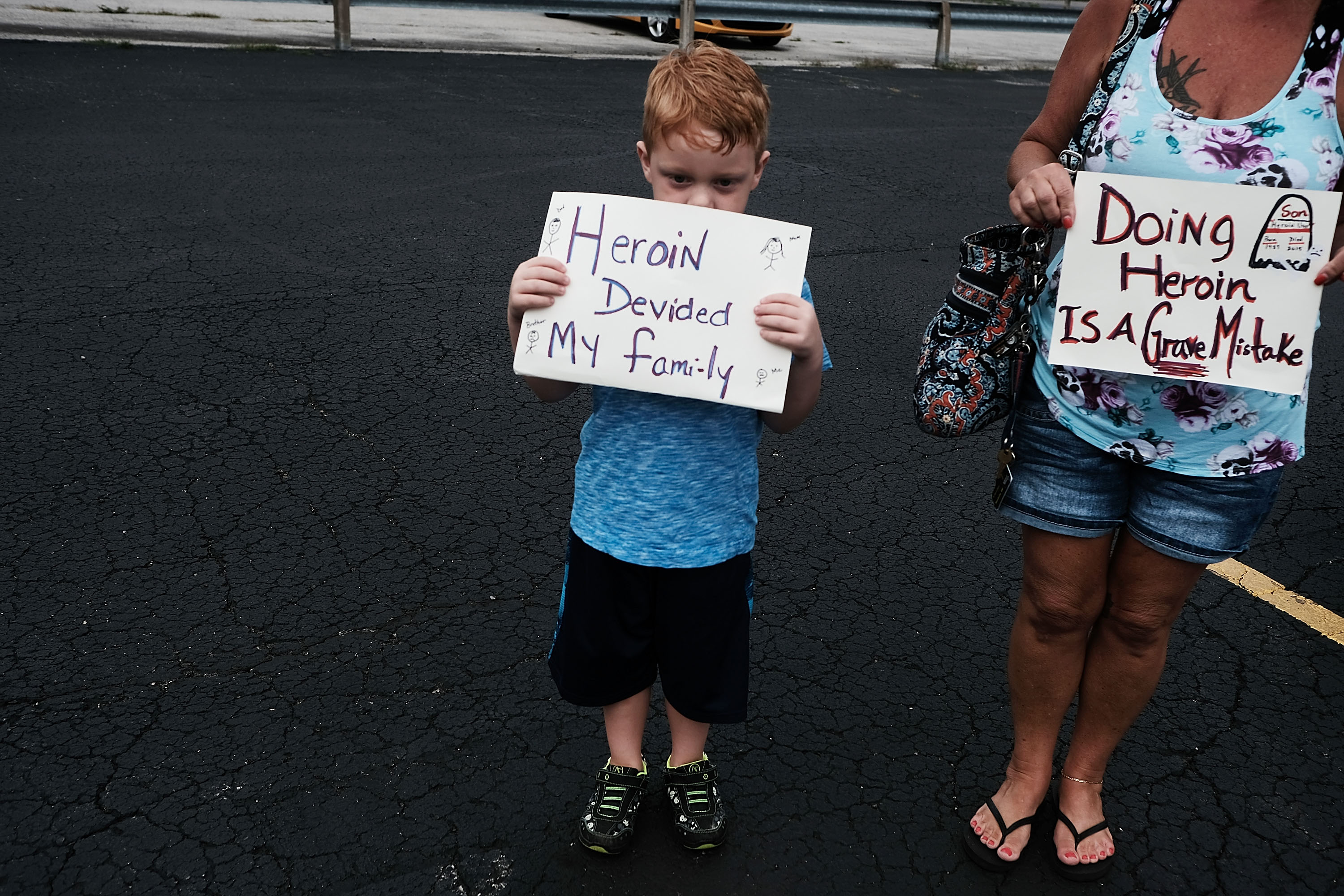 Derrick Slaughter attends a march through the streets of Norwalk against the epidemic of heroin with his grandmother in Norwalk, Ohio. Both of Derrick's parents are heroin addicts and he is now being raised by his grandparents. (Photo by Spencer Platt/Getty Images)