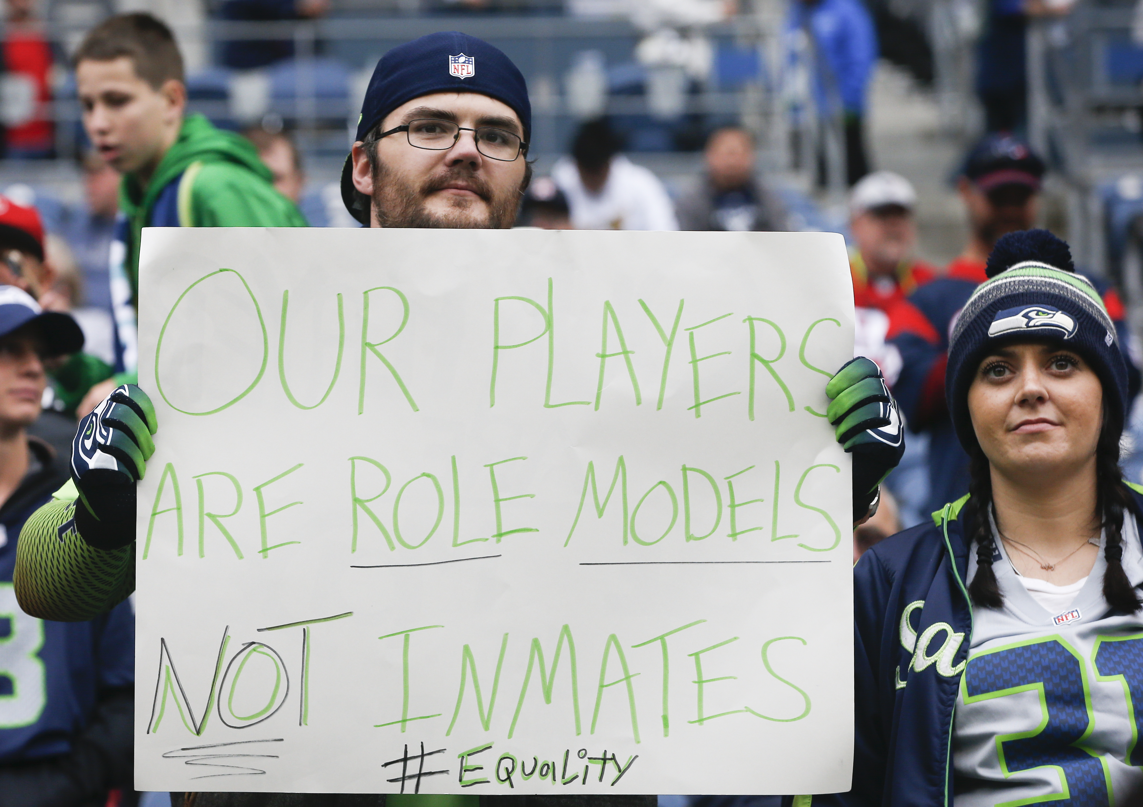 A Seahawks fan holds a sign referencing a comment made by Houston Texans owner Bob McNair before the game between the Houston Texans and Seattle Seahawk (Otto Greule Jr /Getty Images)