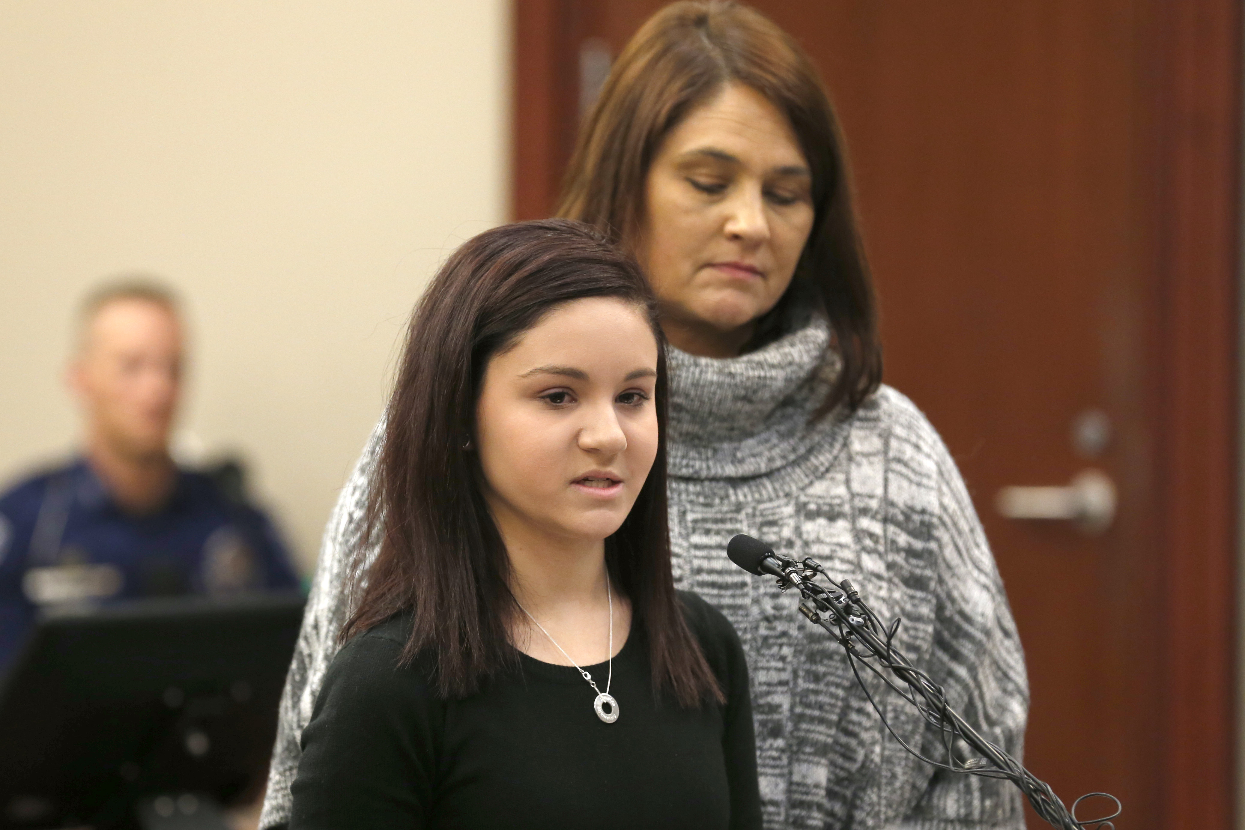 Kaylee Lorincz reacts as former Michigan State University and USA Gymnastics doctor Larry Nassar listens to impact statements during the sentencing phase in Ingham County Circuit Court on January 24, 2018 in Lansing, Michigan.(Photo: JEFF KOWALSKY/AFP/Getty Images)