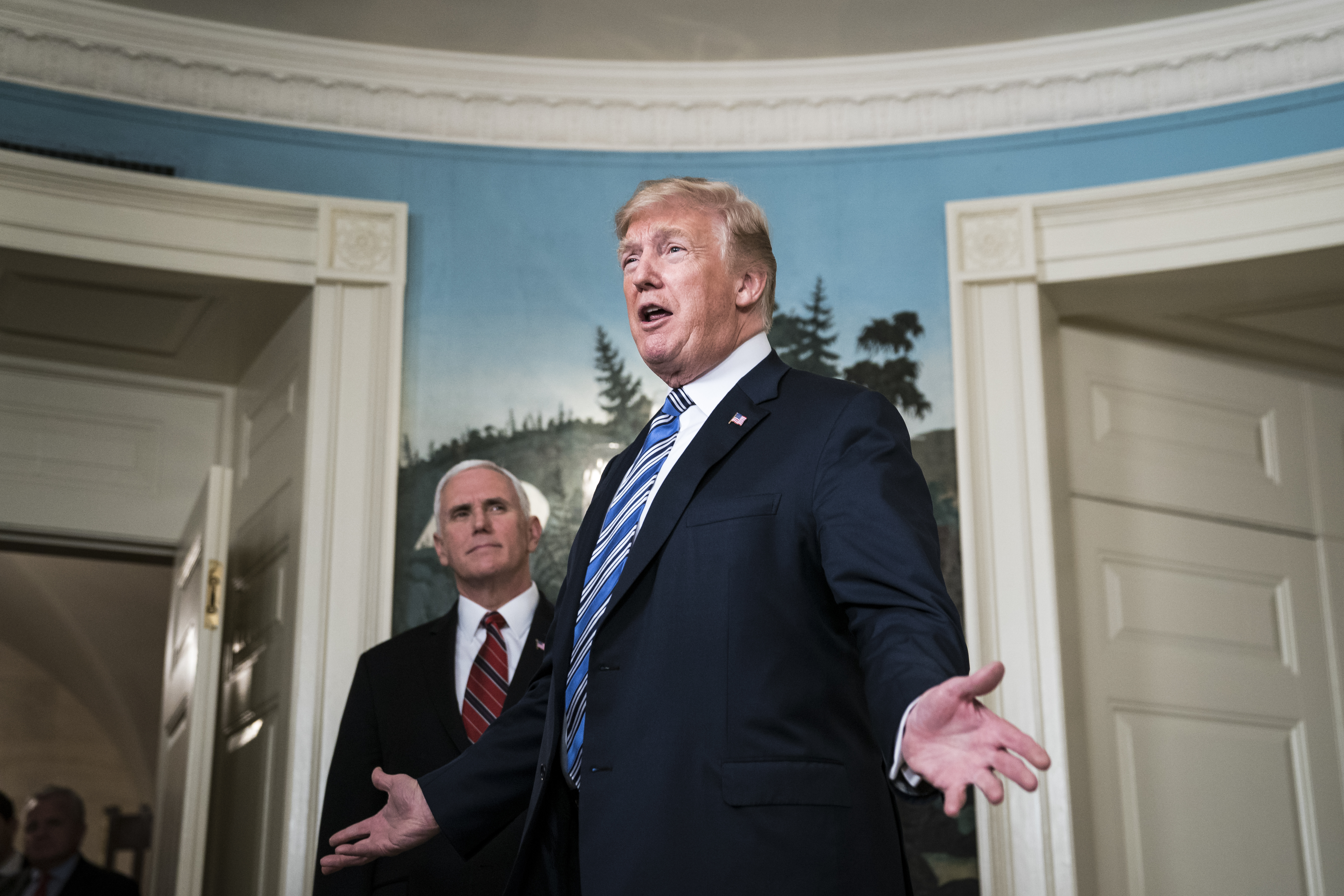 President Trump, with Vice President Pence, speaks after signing the $1.3 trillion spending bill passed by Congress in March. CREDIT: Jabin Botsford/The Washington Post/Getty Images.