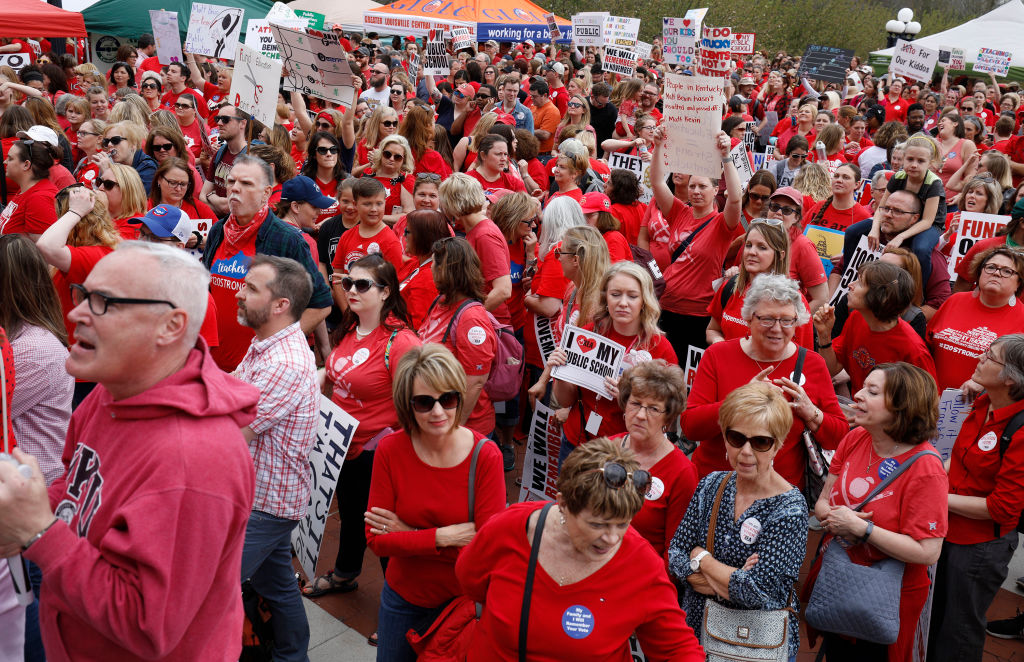 Kentucky Public school teachers rally for a "day of action" at the Kentucky State Capitol to try to pressure legislators to override Kentucky Gov. Matt Bevin's recent veto of the state's tax and budget bills, April 13, 2018 in Frankfort, Kentucky. (Credit: Bill Pugliano/Getty Images)