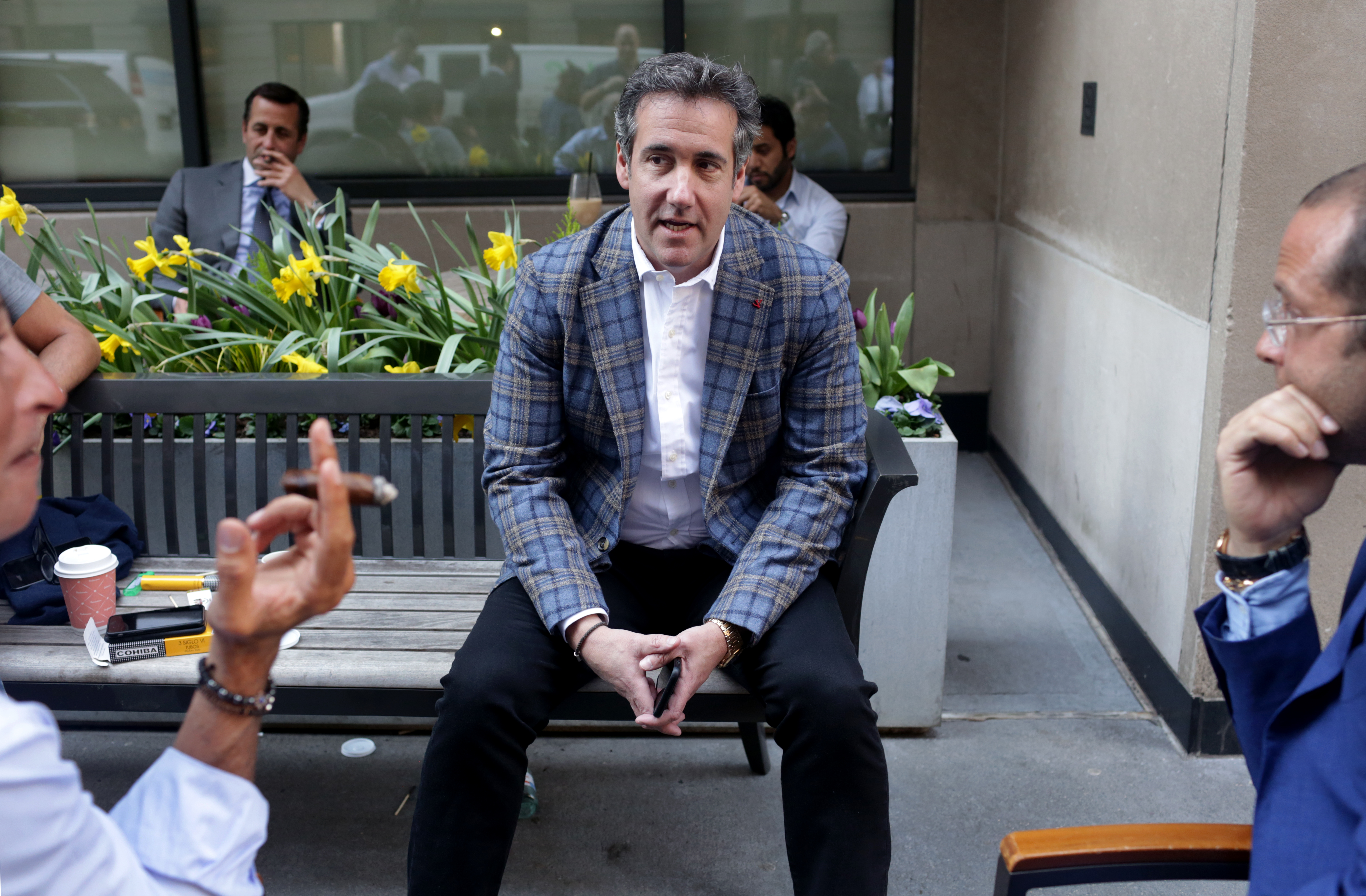 Michael Cohen (C), U.S. President Donald Trump's personal attorney, chats with friends near the Loews Regency hotel on Park Ave on April 13, 2018 in New York City. CREDIT: Photo by Yana Paskova/Getty Images