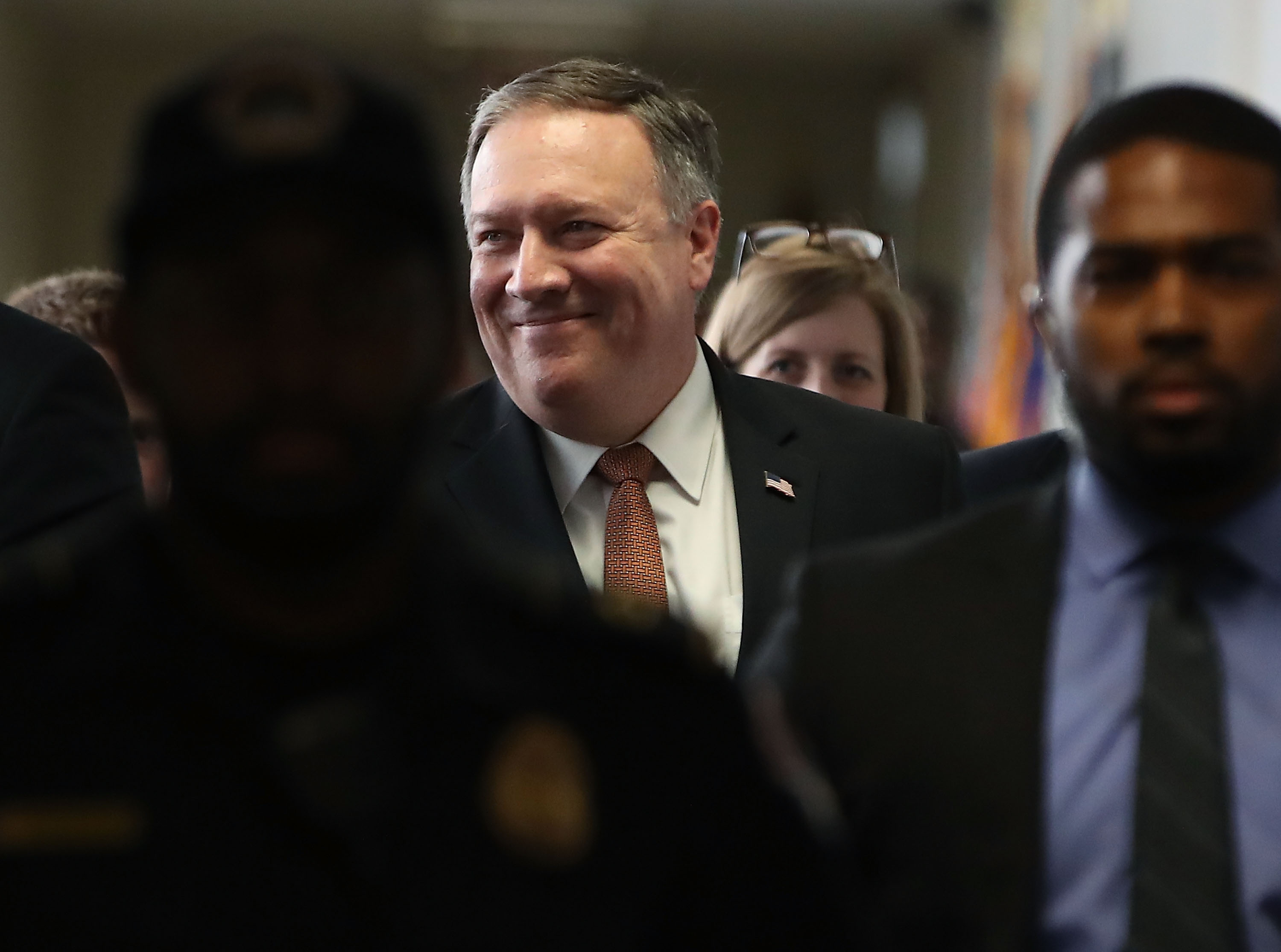 Pompeo smiles as he walks to a meeting on Capitol Hill April 18, 2018 in Washington, DC. CREDIT: Mark Wilson/Getty Images.