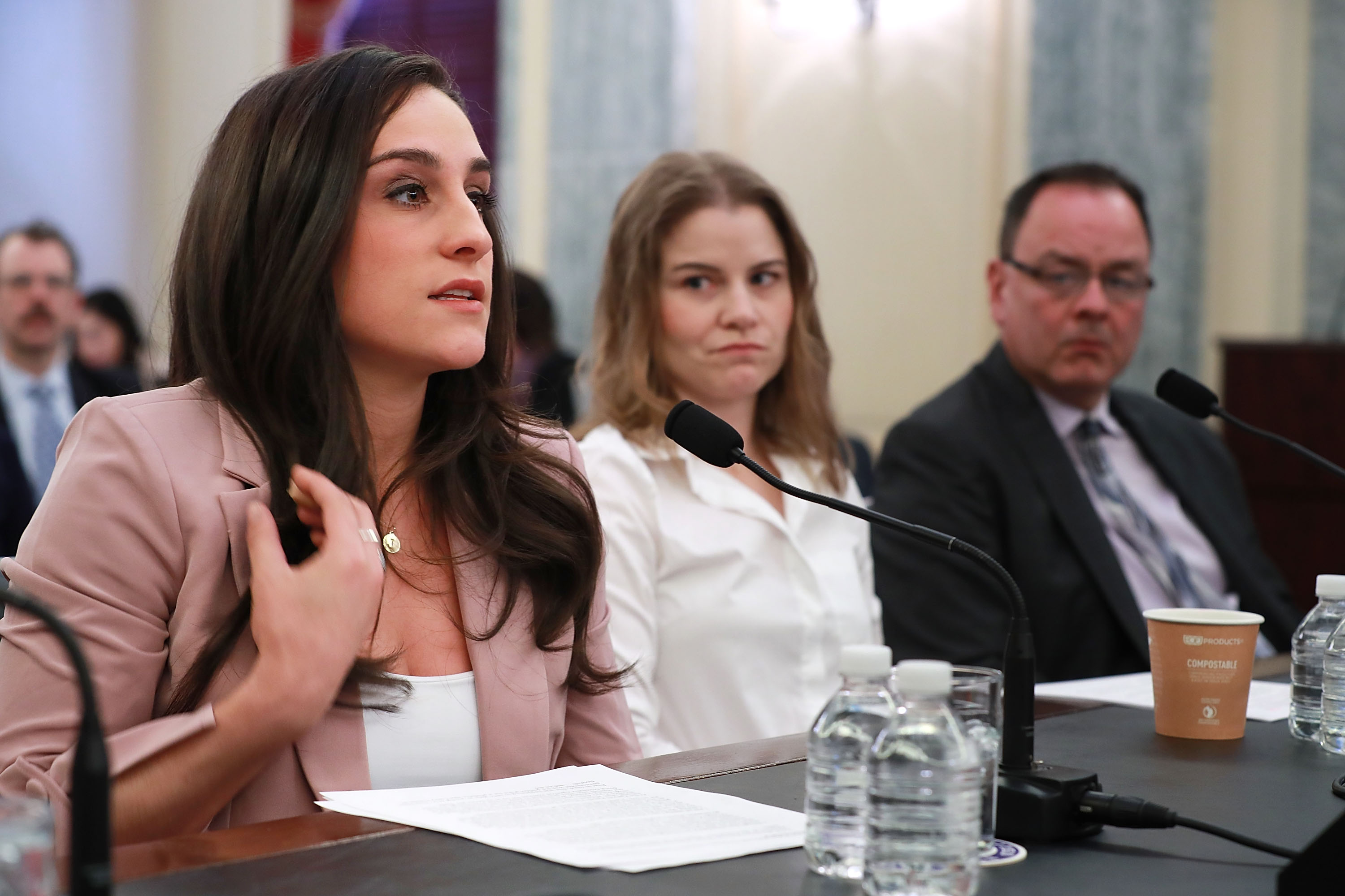 WASHINGTON, DC - APRIL 18: Olympic gymnastics gold medalist Jordyn Wieber (L) recounts her sexual abuse at the hands of team doctor Larry Nassar while testifying before the Senate Commerce, Science and Transportation Committee's Consumer Protection, Product Safety, Insurance and Data Security Subcommittee with fellow abuse victims speedskater Bridie Farrell and figureskater Craig Maurizi in the Russell Senate Office Building on Capitol Hill April 18, 2018 in Washington, DC. The athletes testified during the hearing titled 'Olympic Abuse: The Role of National Governing Bodies in Protecting Our Athletes.' (Photo by Chip Somodevilla/Getty Images)