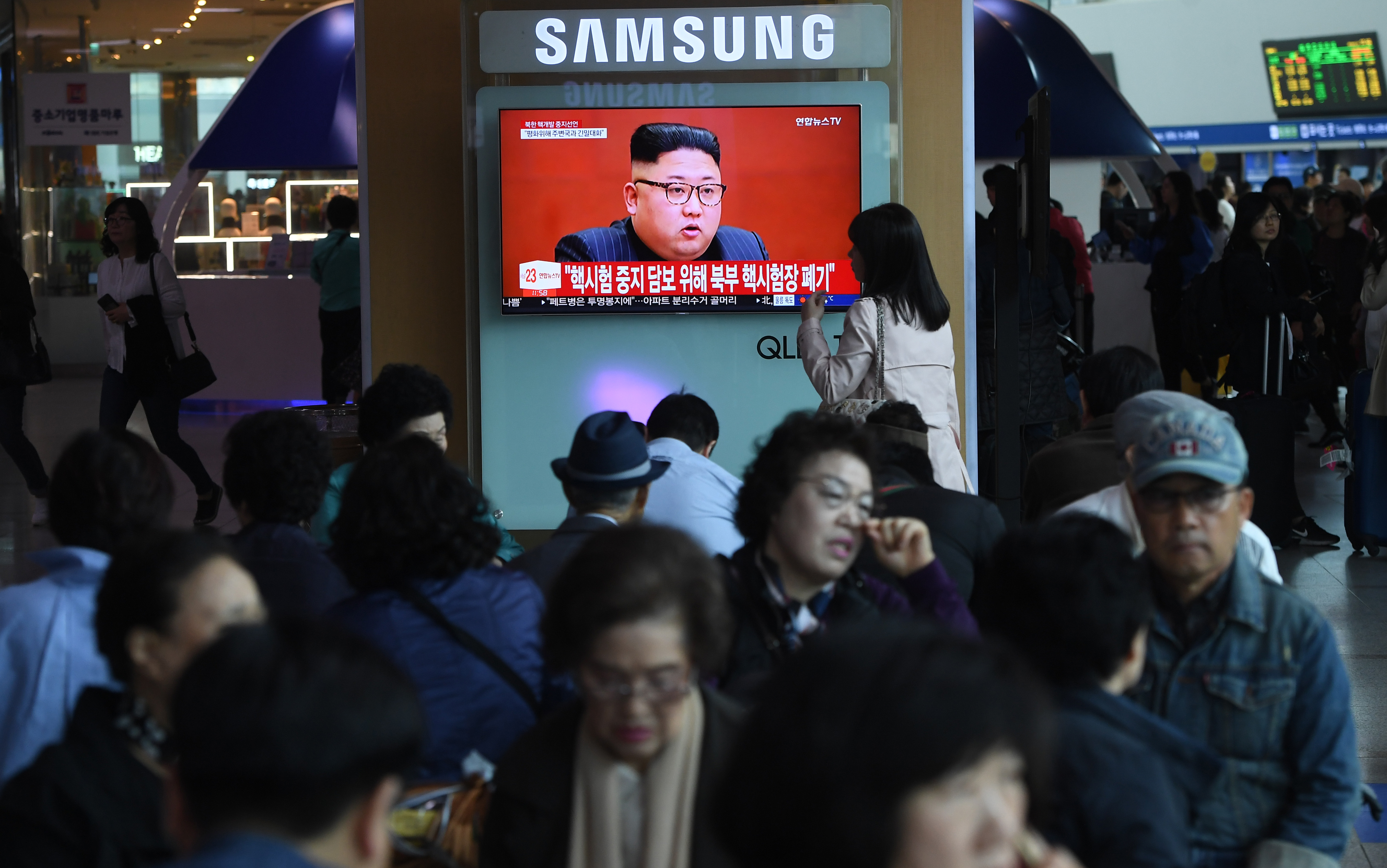 People in Seoul, South Korea, watch a news report about North Korean dictator Kim Jong Un. CREDIT: Jung Yeon-je / AFP / Getty Images
