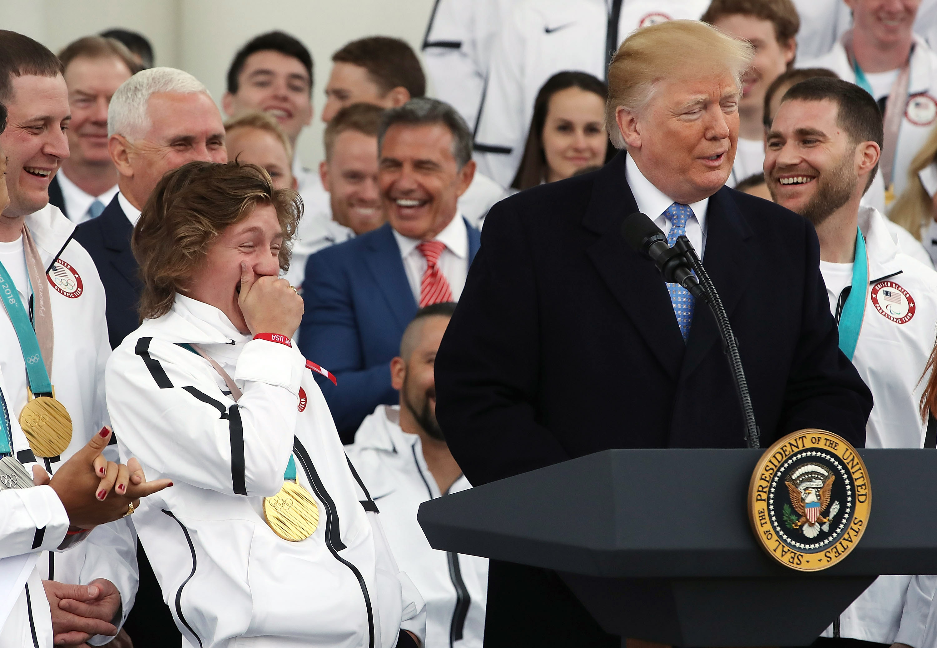 Olympic gold medalist snowboarder Red Gerard reacts as President Donald Trump speaks during a celebration of the USA 2018 Winter Olympic and Paralympic Teams on the North Portico of the White House. CREDIT: Mark Wilson/Getty Images