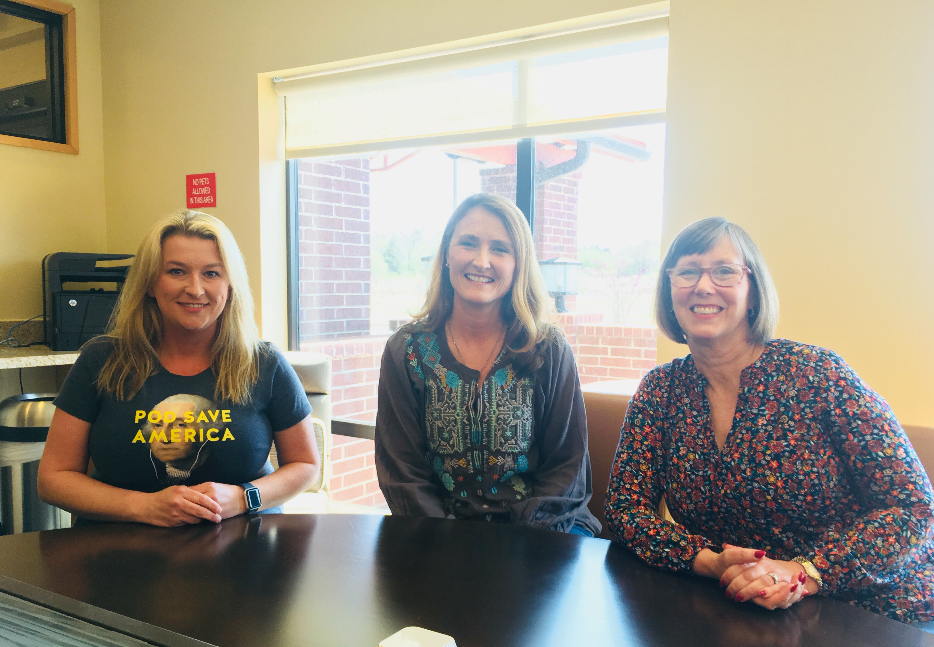 Owasso residents Tobra Avery (left), Kathy Rutherford (center), and Dana McConnell (right) discuss the Oklahoma teacher walkout in Owasso, OK. (Photo: Esther Y. Lee)